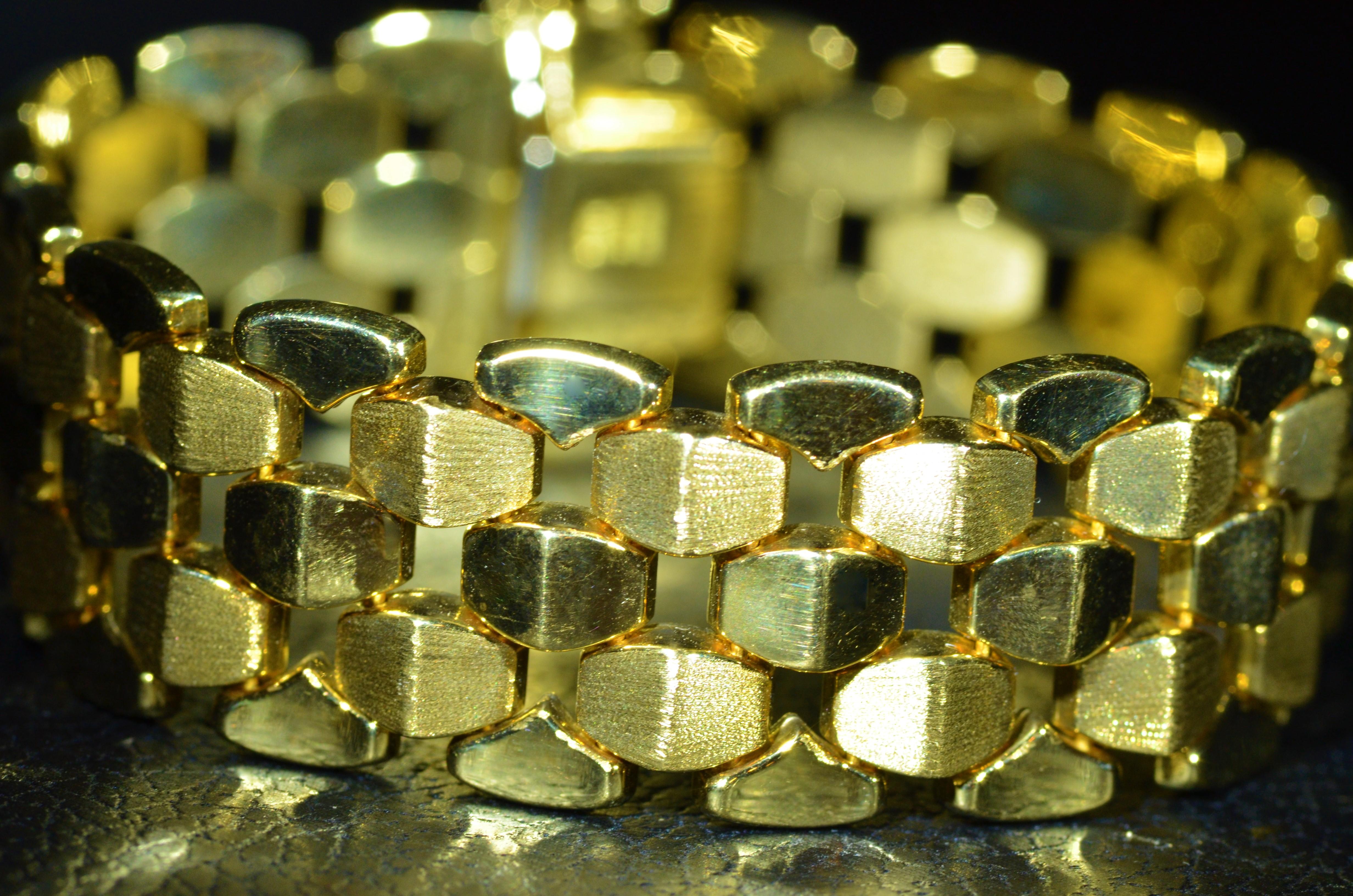 18 Karat yellow gold retro modernist bracelet.  Links are brushed and polished for a very attractive eye appeal.  The bracelet is Italian made by Milros