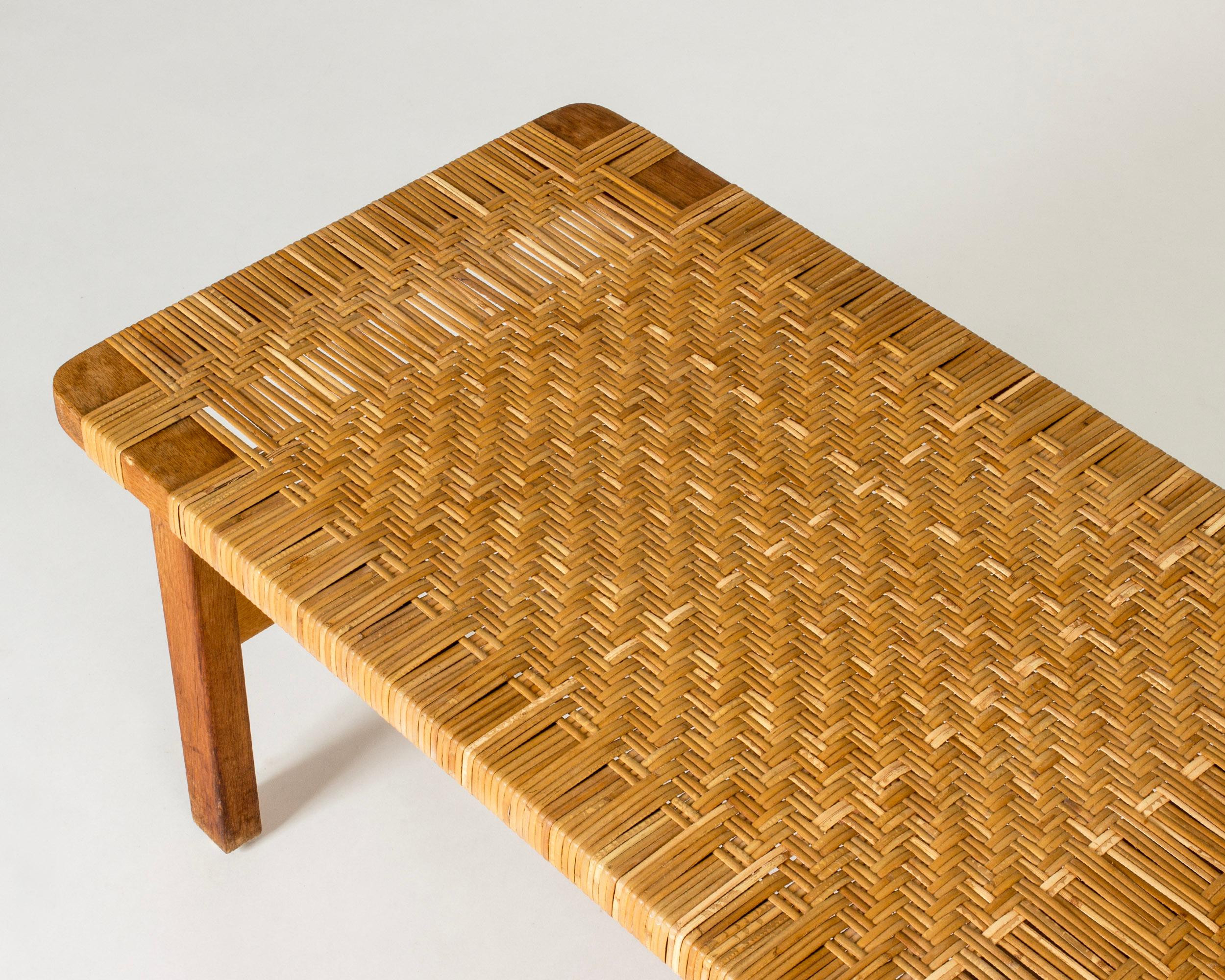 Beautiful oak and rattan bench by Børge Mogensen. Great materials, low design that works both as a bench and a coffee table.