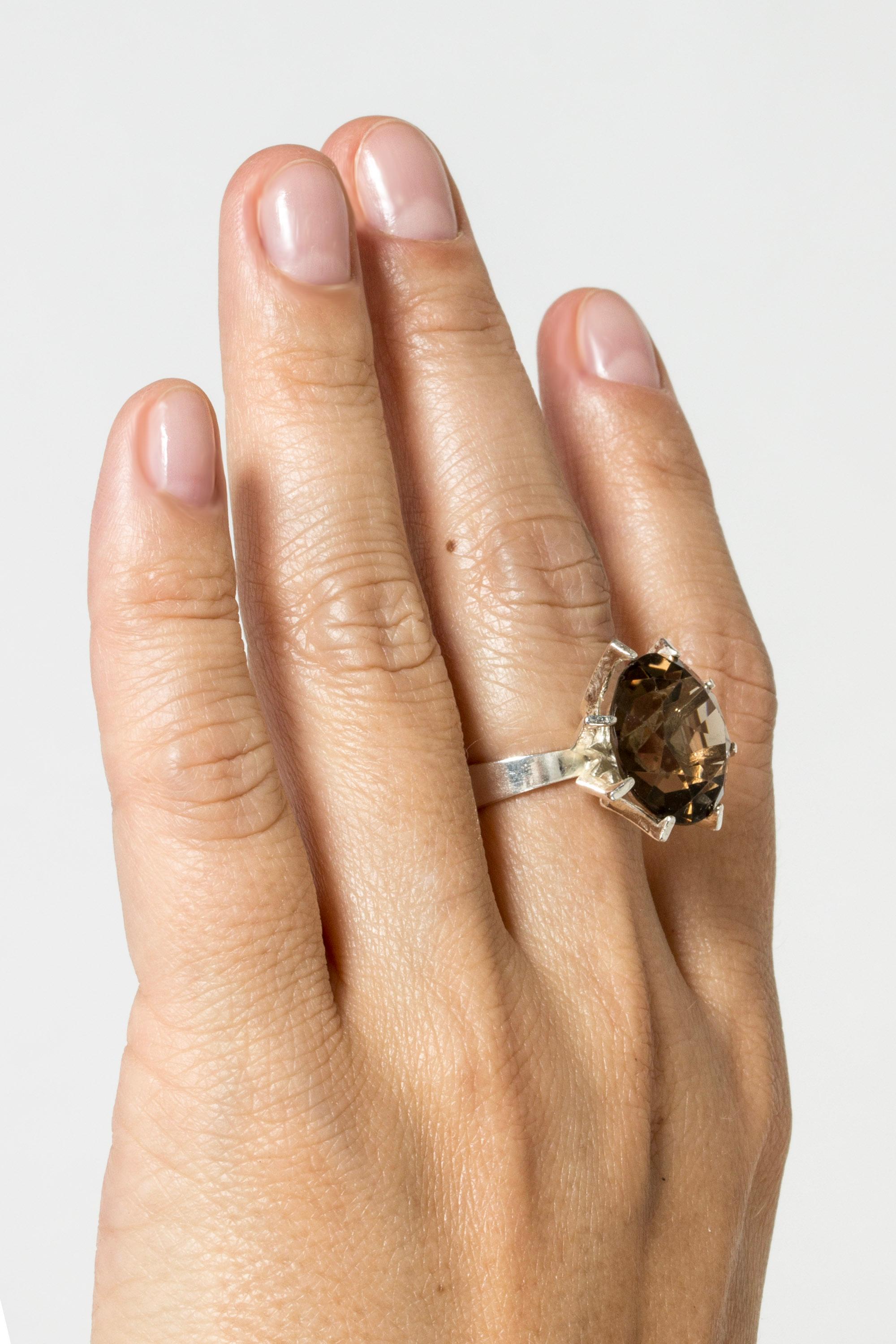 Beautiful, sparkly silver ring from Erik Granit, with a large smoke quartz stone. The stone is elevated so that light flows freely around it.