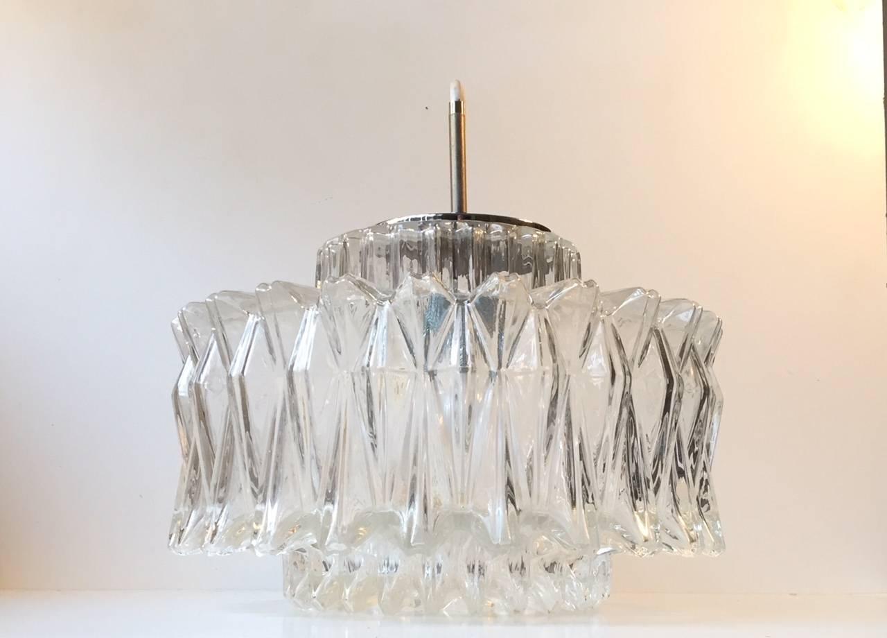 Large multifaceted pendant light with a star or sunburst theme/motif. Manufactured by Limburg in Germany during the 1960s. This is model P 991. The style is reminiscent of Orrefors and Kalmar. It has its markers mark to the inside of the shade.