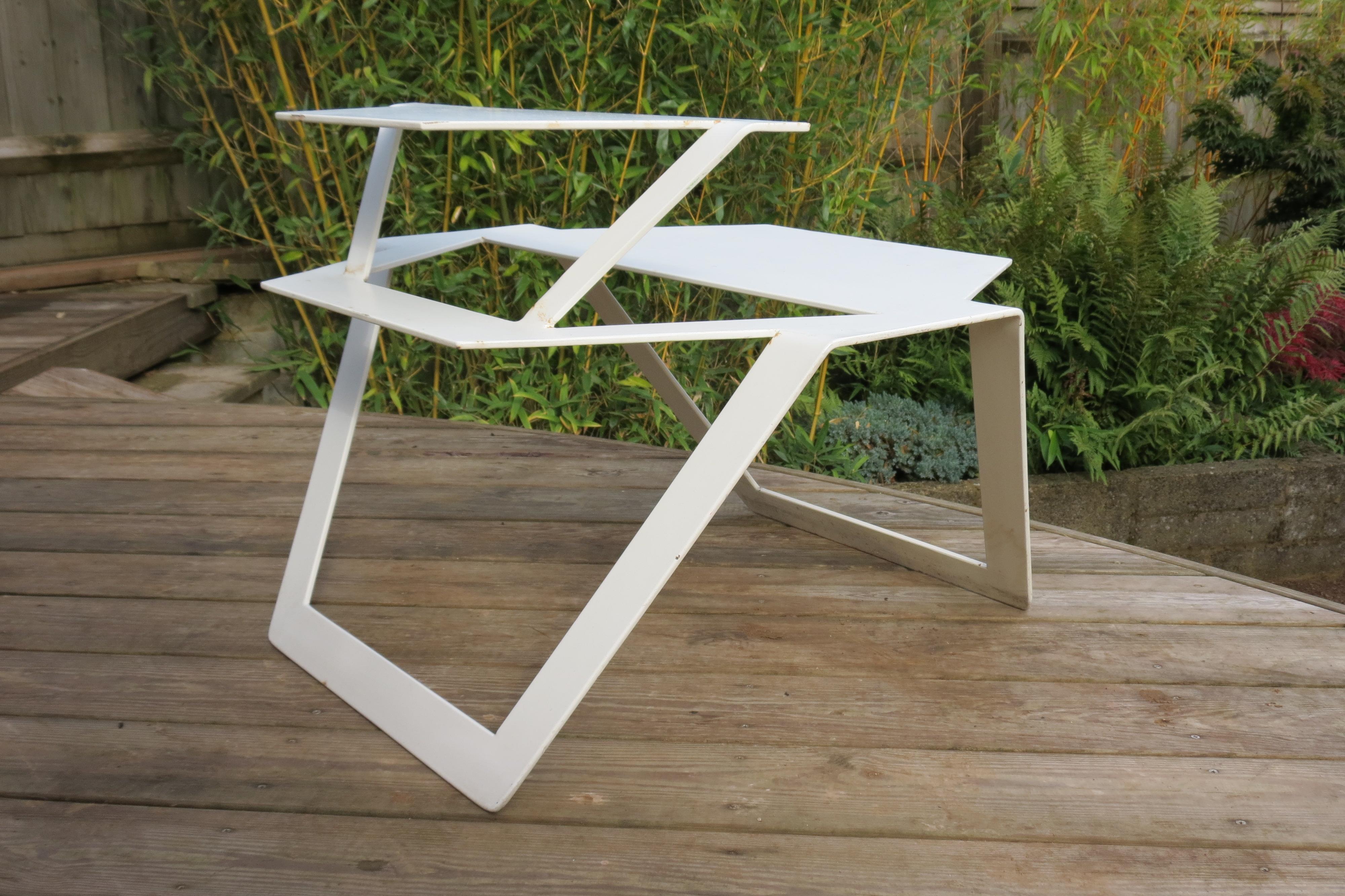 A very good quality metal table from the 1990s, good quality thick steel. Very cleverly cut and formed from one sheet of metal. Possibly a prototype. Very heavy good quality, well constructed table.
Good over-all condition, some wear, marks and