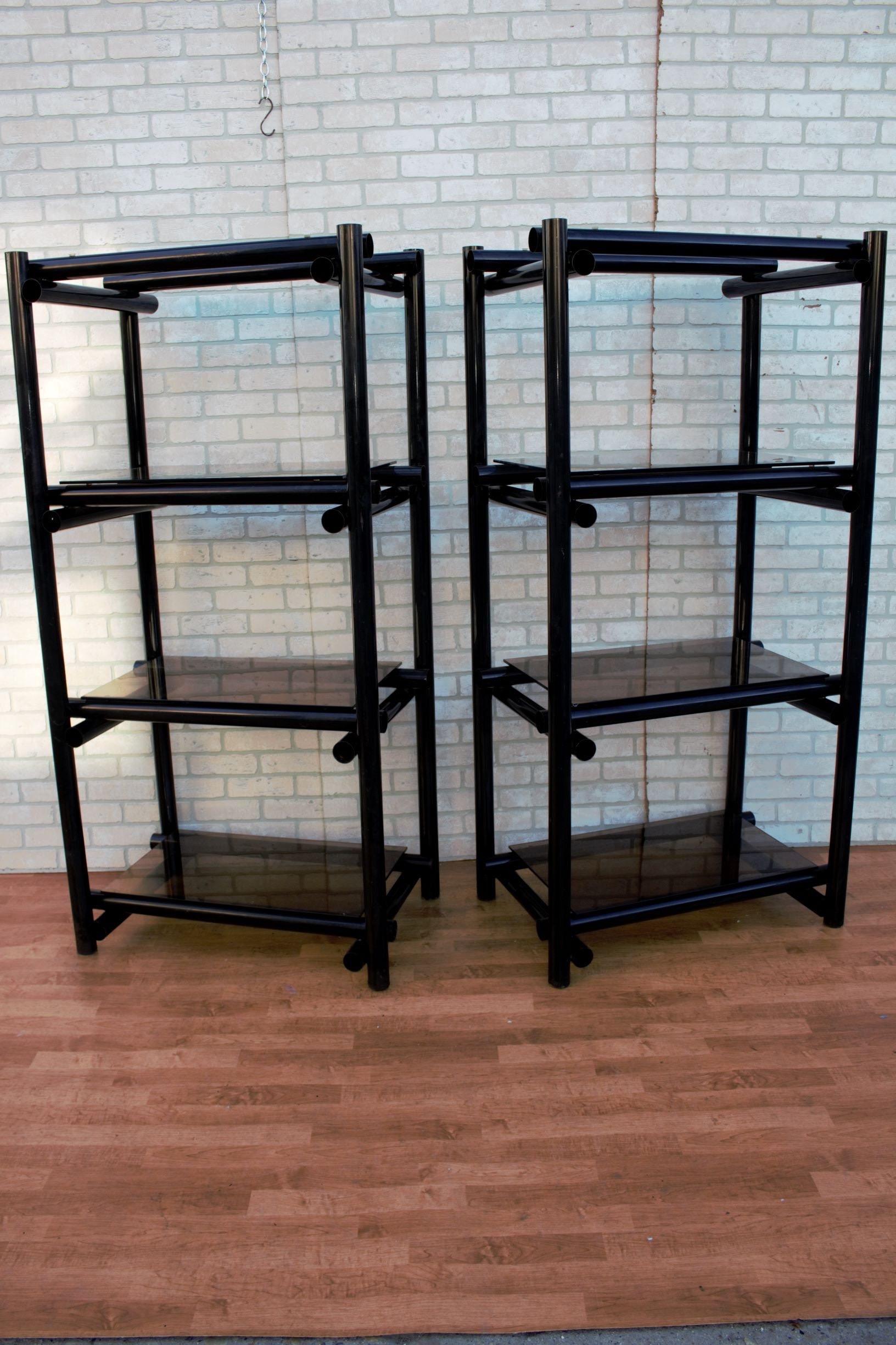 Vintage Modernist Tubular black metal shelving units/Etagere with tinted glass - pair 

Vintage Modernist Smoked Glass and Tubular Chrome Étagère 

These modern style etageres capture the Classic materials of modernism, metal and tinted glass.