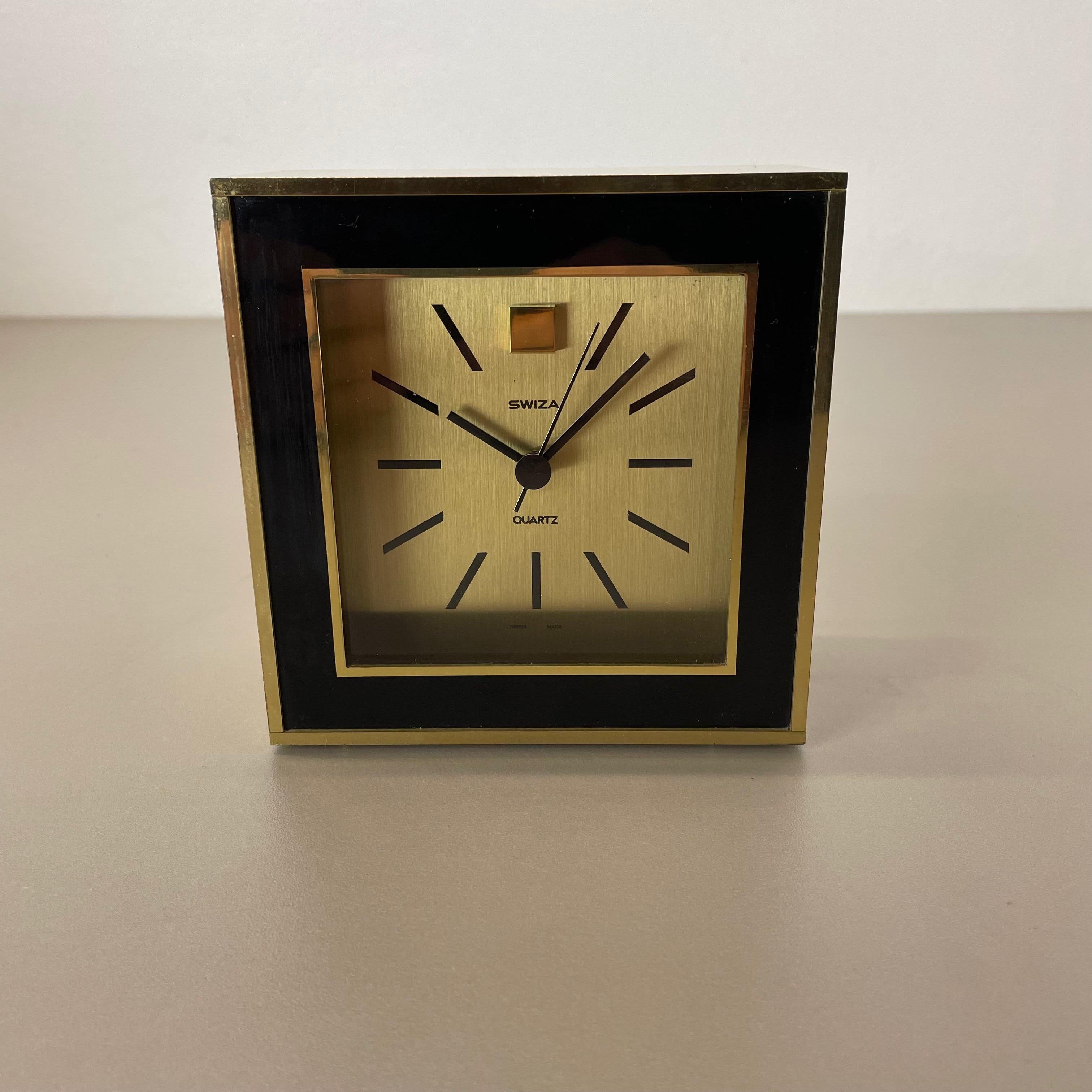 Article:

Table clock



Origin:

Switzerland


Producer:

Swiza, Switzerland


Age:

1970s





This original vintage table clock was produced in the 1970s by the premium clock producer SWIZA in Switzerland. The clock is