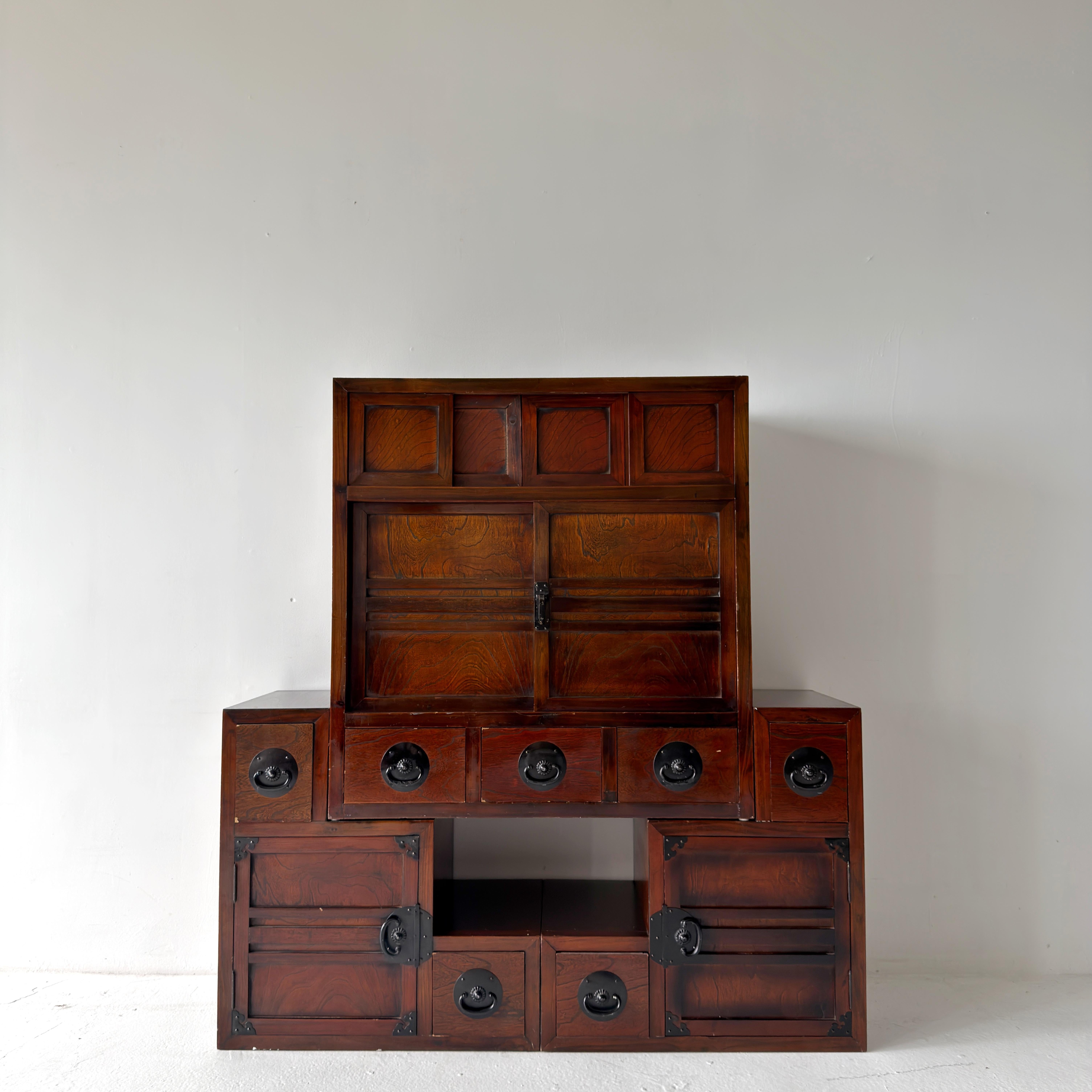 Vintage modular Japanese tansu chest. Solid wood with over a dozen doors and drawers on both sides of the piece—can be configured in a variety of shapes.

dimensions:
symmetrical: w49.5