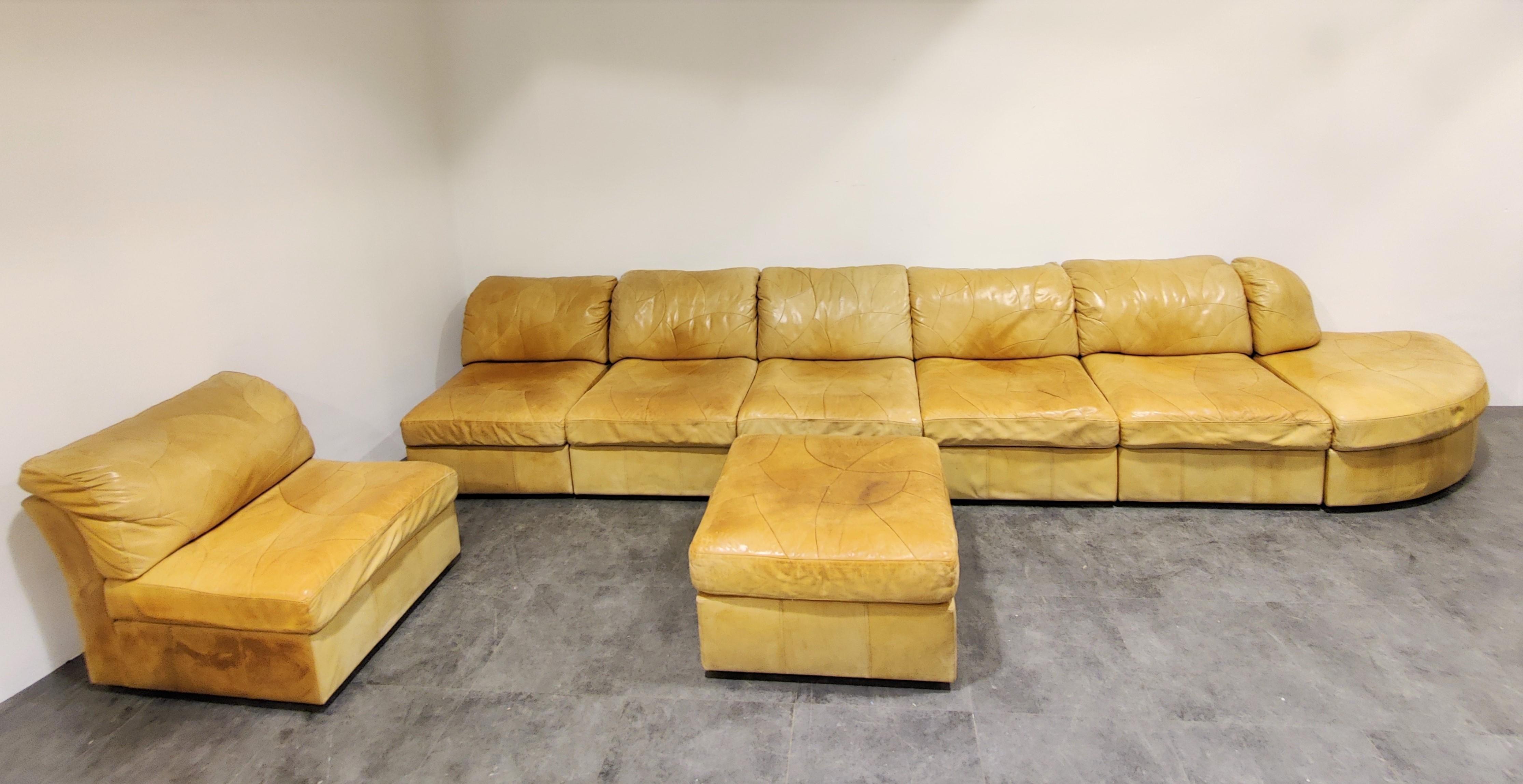 Stunning sectional/modular sofa set in beautifully patinated beige leather by Laauser, Germany.

The sofa set is completely modular and consists of 7 elements and an ottoman.

Ideal piece to create a free standing sofa space which will be the