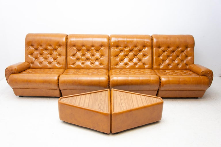 This leatherette modular living room set is a typical example of furniture design of the 1970/1980´s
It was made in Western Europe.
It can used as a) 4-seater sofa, b) corner sofa c) 4 chairs with side tables.
The furniture is in very good