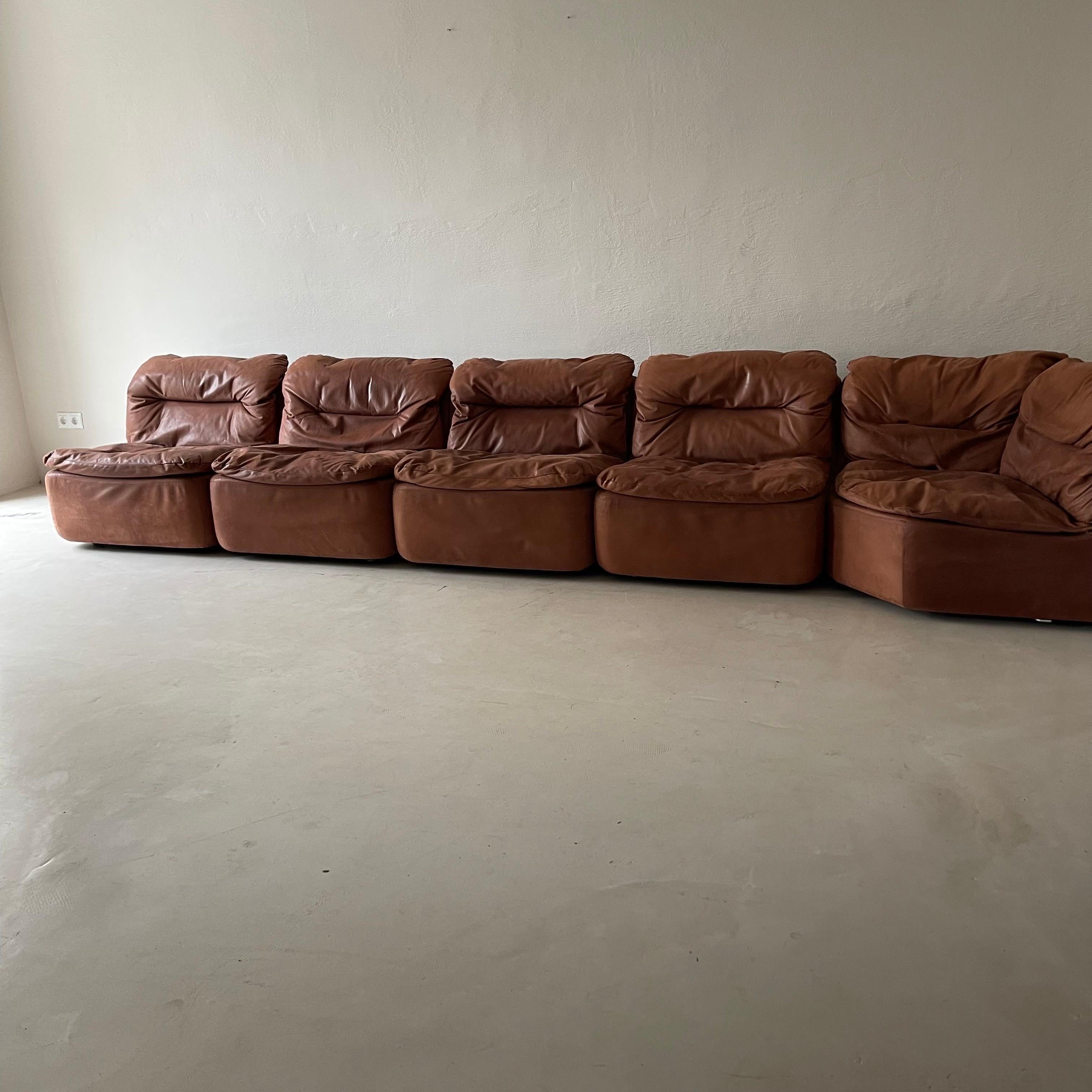 Vintage Modular Sofa by Friedrich Hill for Walter Knoll. Great comfort and style in very soft Terracotta colored leather with a fantastic 70s vibe that is so in demand right now. Can be placed as a straight, long sectional with curved unit at the