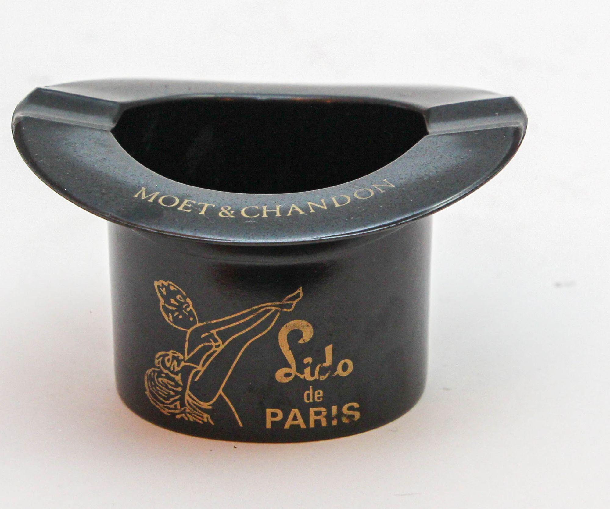 Vintage Moët & Chandon Lido de Paris Ashtray Vintage Top Hat Made in France 1970s.
This little top hat is from the Lido in Paris and advertising Moet & Chandon.
Dimensions: 2.25