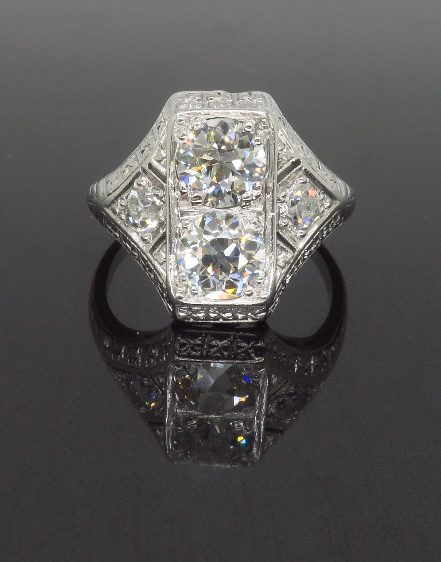 Vintage Moi et Toi ring made in Platinum with 2.02ctw of Diamonds. 

Center Diamond Carat Weights: .85ct & .87
Diamond Color: G-H
Diamond Clarity: VS1-VS2
Diamond Cut: Old European Cut  
Side Diamond Carat Weight: .15ctw
Diamond Color: G-H
Diamond