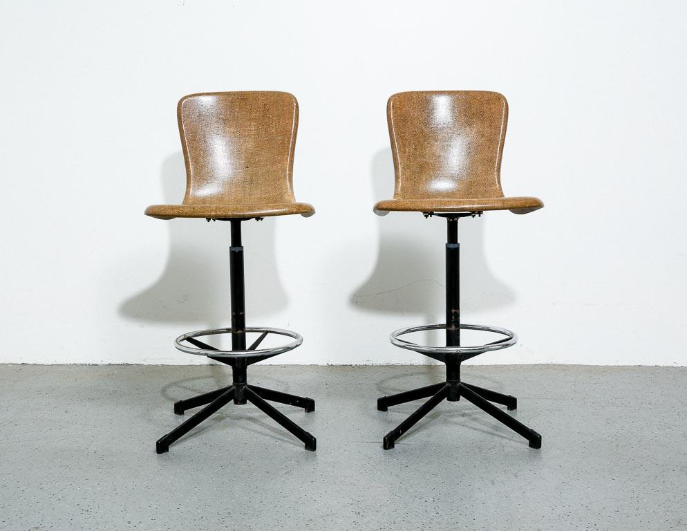 Vintage adjustable stools in molded burlap-reinforced plastic. 