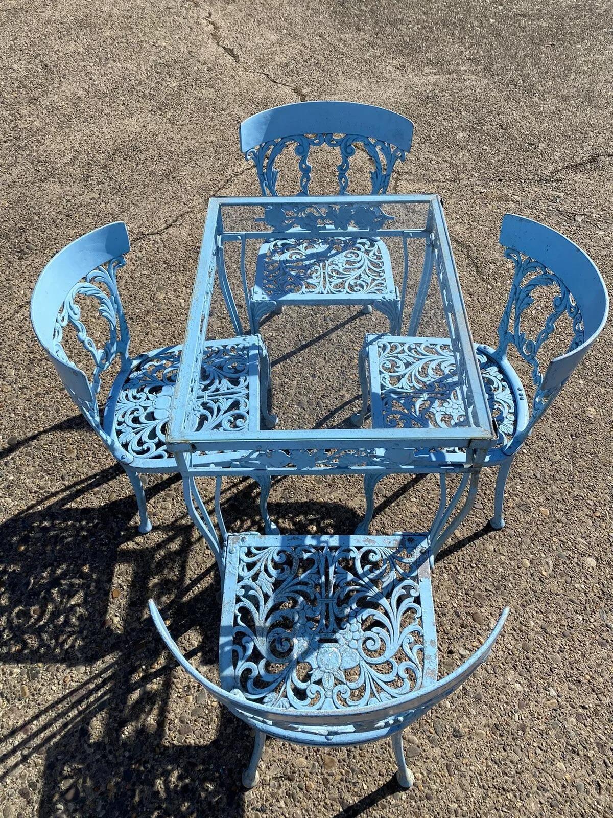 Vintage Molla Cast Aluminum Victorian Style Blue Garden Patio Dining Set - 5 Pc Set. Listing includes (1) Small glass top table, (4) Curved back dining chairs, all constructed of cast aluminum with fruit and harvest design throughout and a blue