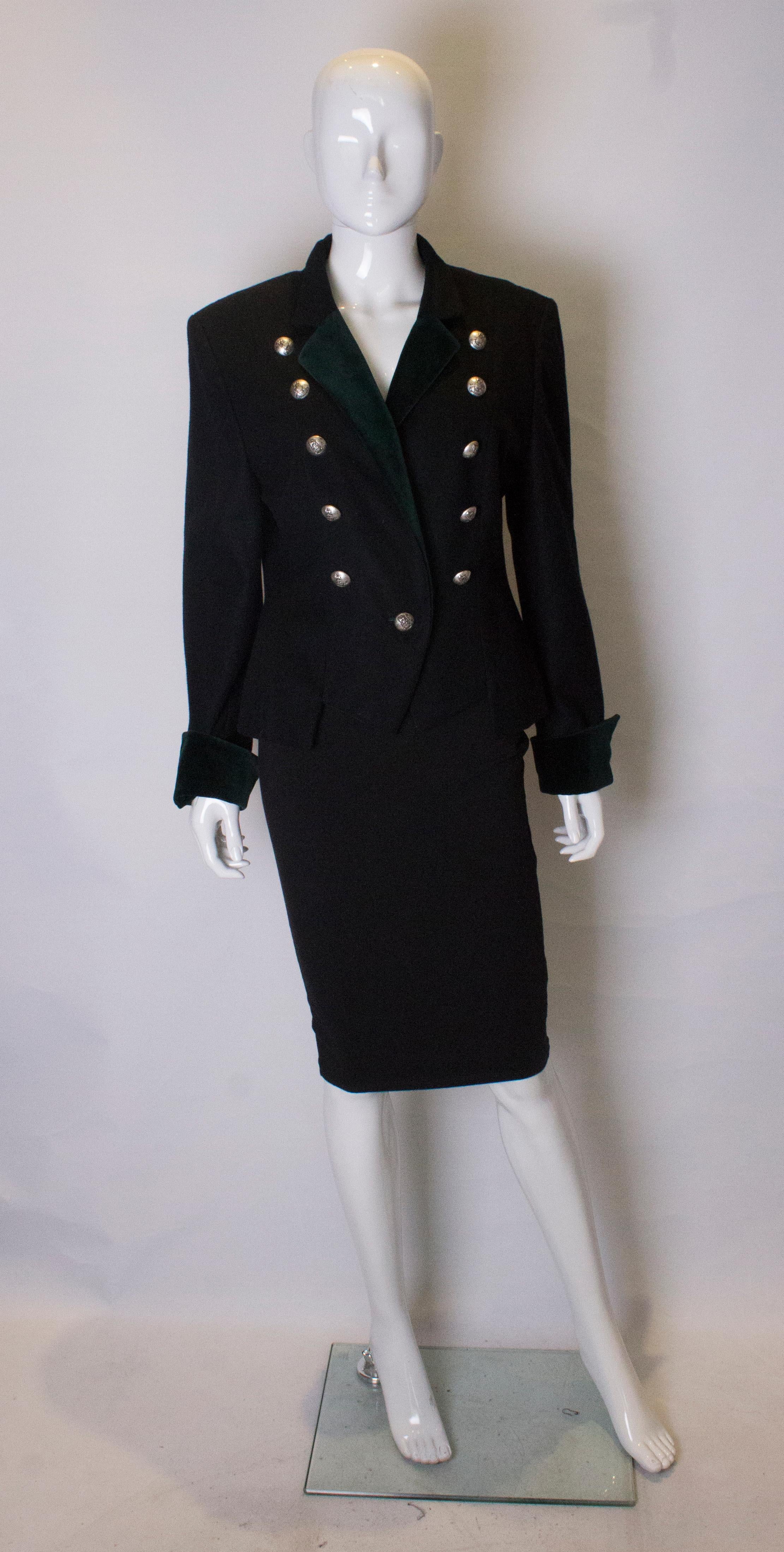 A chic and easy to wear military style jacket by Mondi. The jacket is a wool and cashmere mix with velvet collar and cuffs. It has an interesting cutaway hem, and is fully lined.