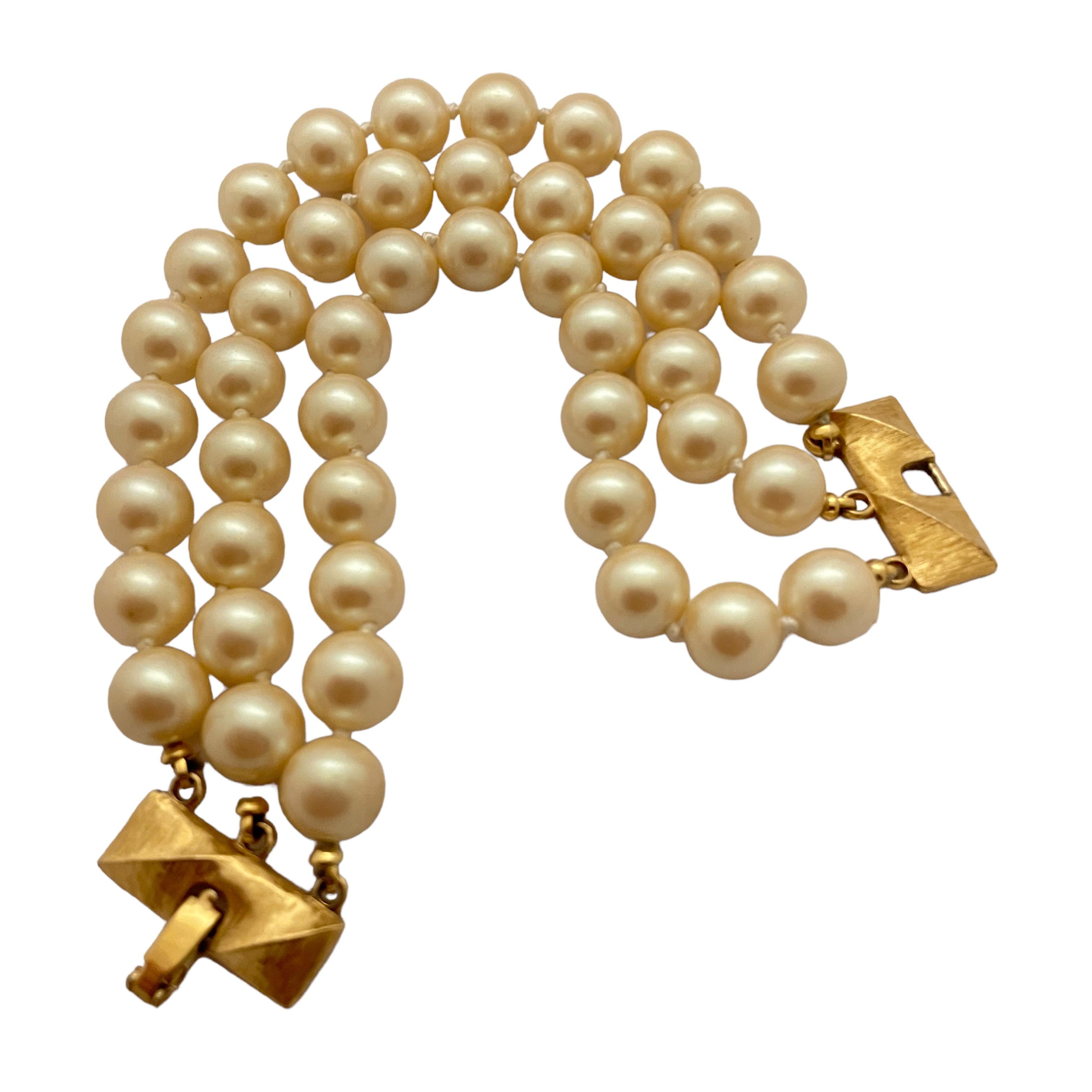 DETAILS

• signed MONET

• gold tone with pearls

• vintage designer runway bracelet  

MEASUREMENTS  

• 7.75