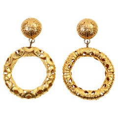 Vintage Monet Gold Tone Dangling  Etruscan Hoop Earrings Circa 1980s