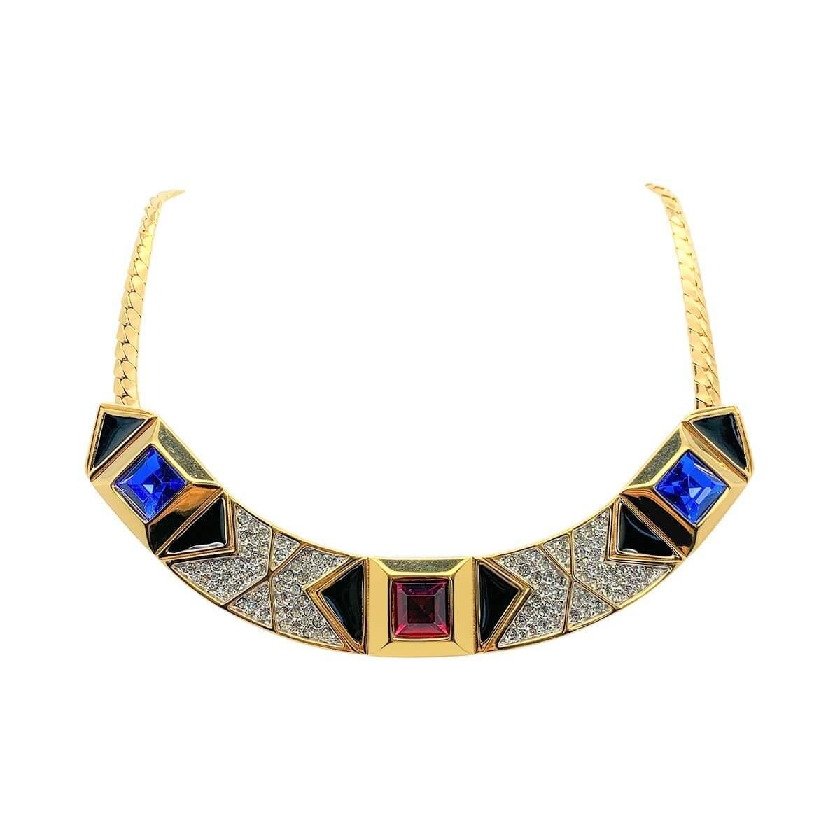 A sumptuous vintage Monet jewel necklace. Featuring crystal gem coloured stones, pave set crystals and enamel in an art deco inspired style.
Vintage Condition: Very good without damage or noteworthy wear. 
Materials: Gold plated metal, enamel, glass