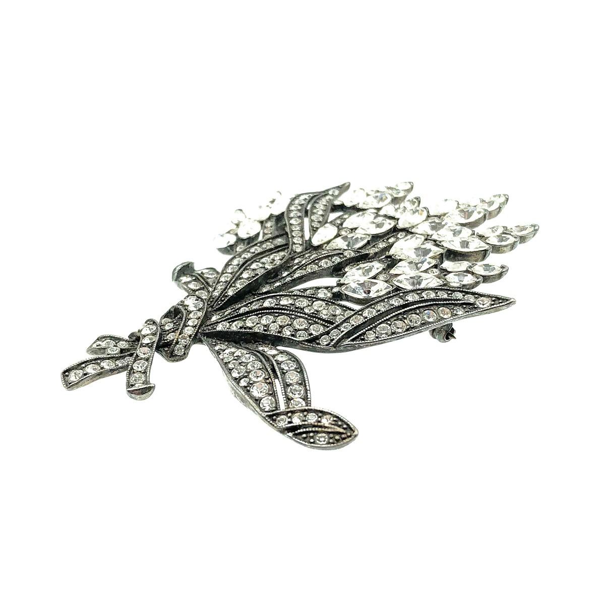 An impressive Vintage Monet Floral Brooch. Crafted in blackened silver-tone metal and set with a glorious array of crystals. Signed, in very good vintage condition, approx. 8.5cm. A beautiful statement floral pin that oozes glam and style.