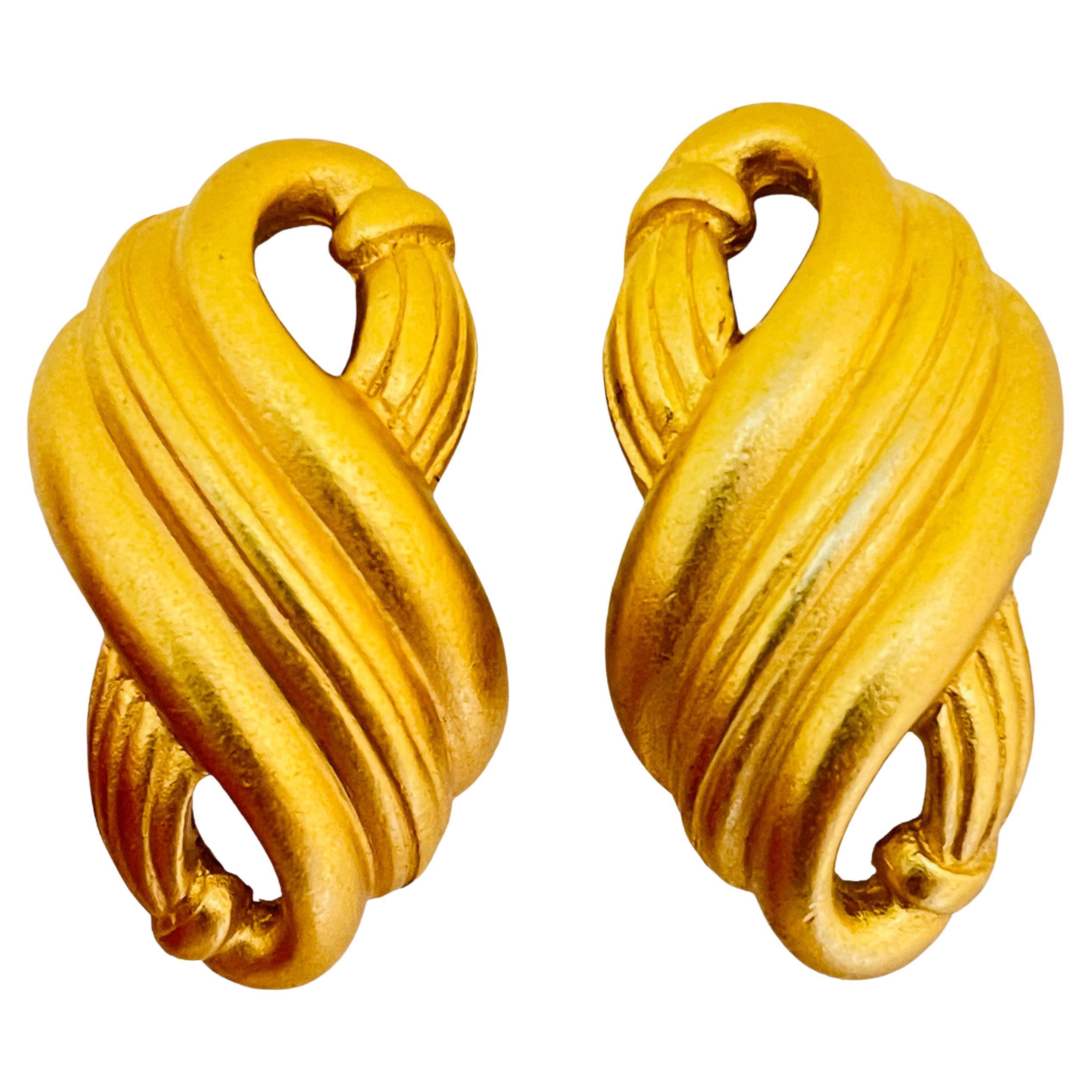 Vintage MONET matte gold designer clip on earrings For Sale