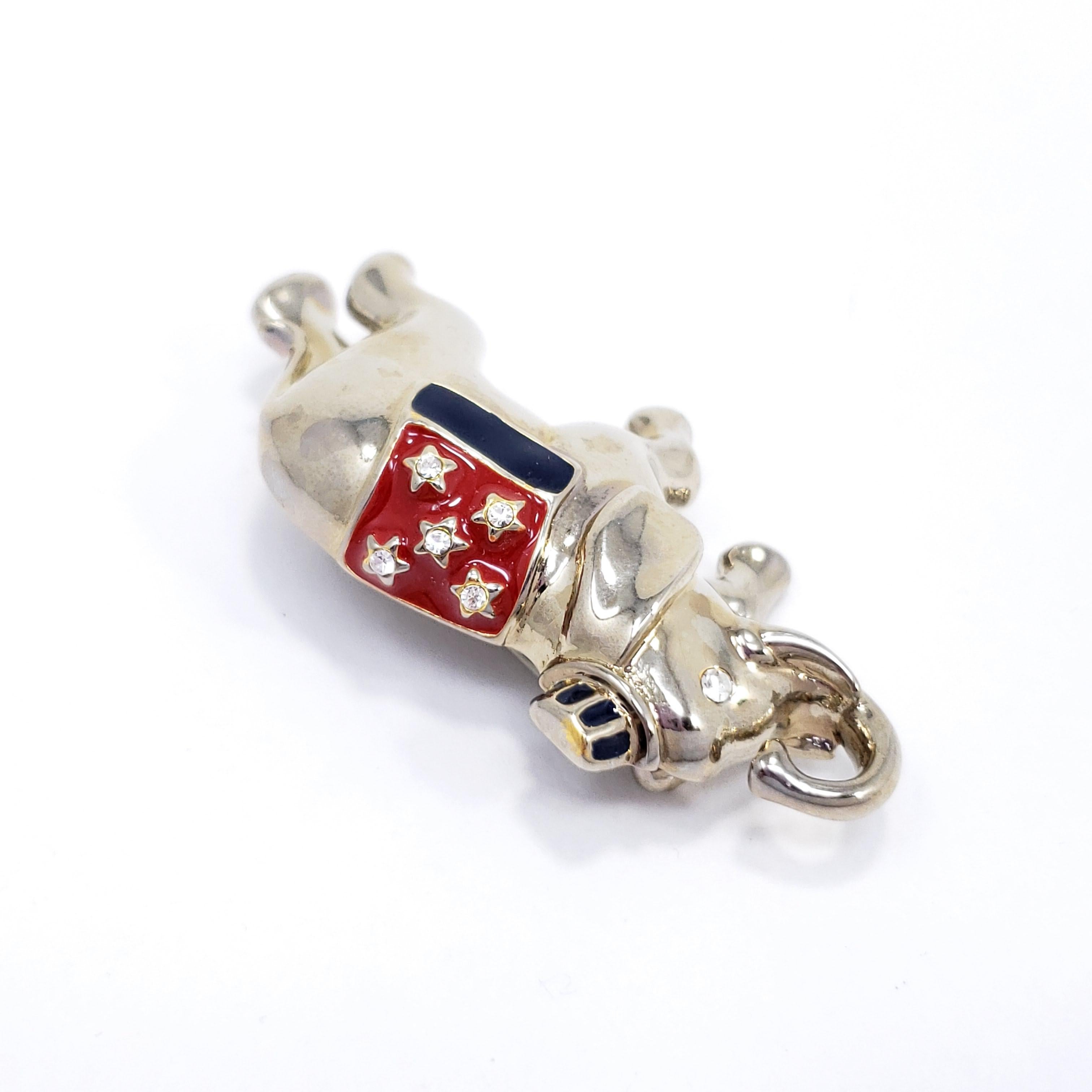 This patriotic pin features a silver-tone elephant, accented with clear crystals and red & blue enamel. By Monet.

Marks / hallmarks / etc: Monet