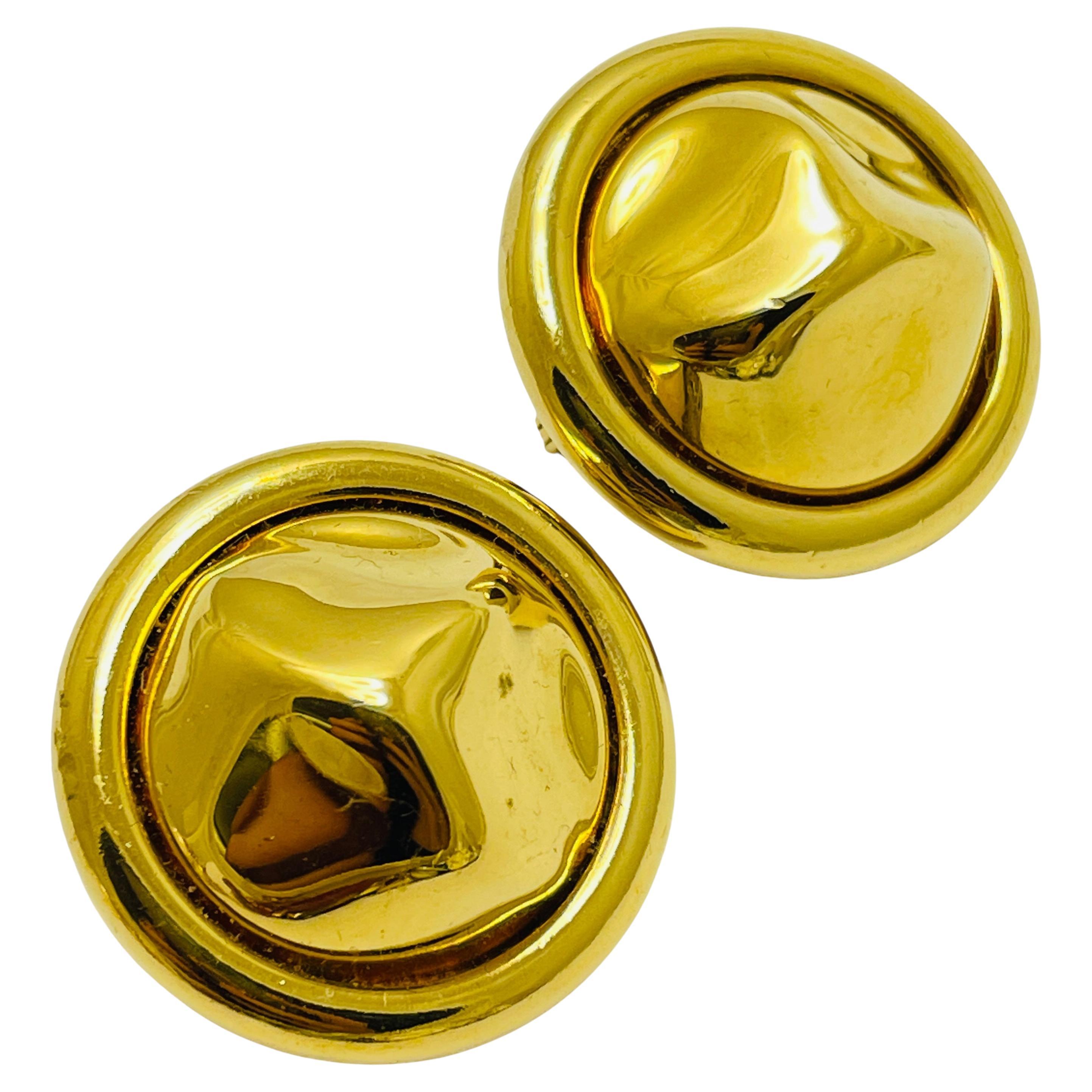 Vintage MONET signed gold tone designer clip on earrings For Sale