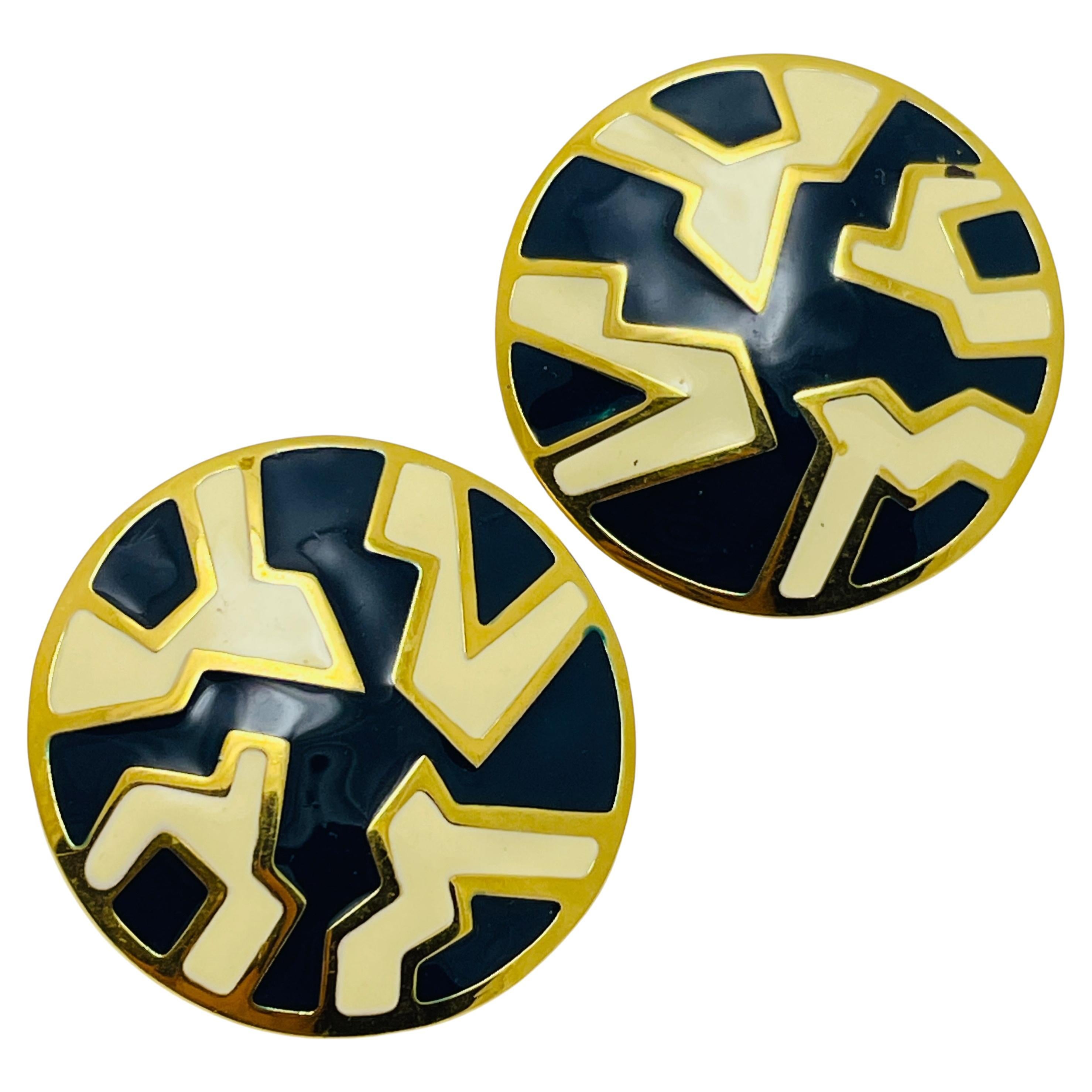 Vintage MONET signed gold tone enamel modernist designer clip on earrings For Sale