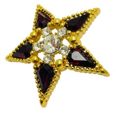 Vintage MONET signed gold tone red rhinestone designer star brooch