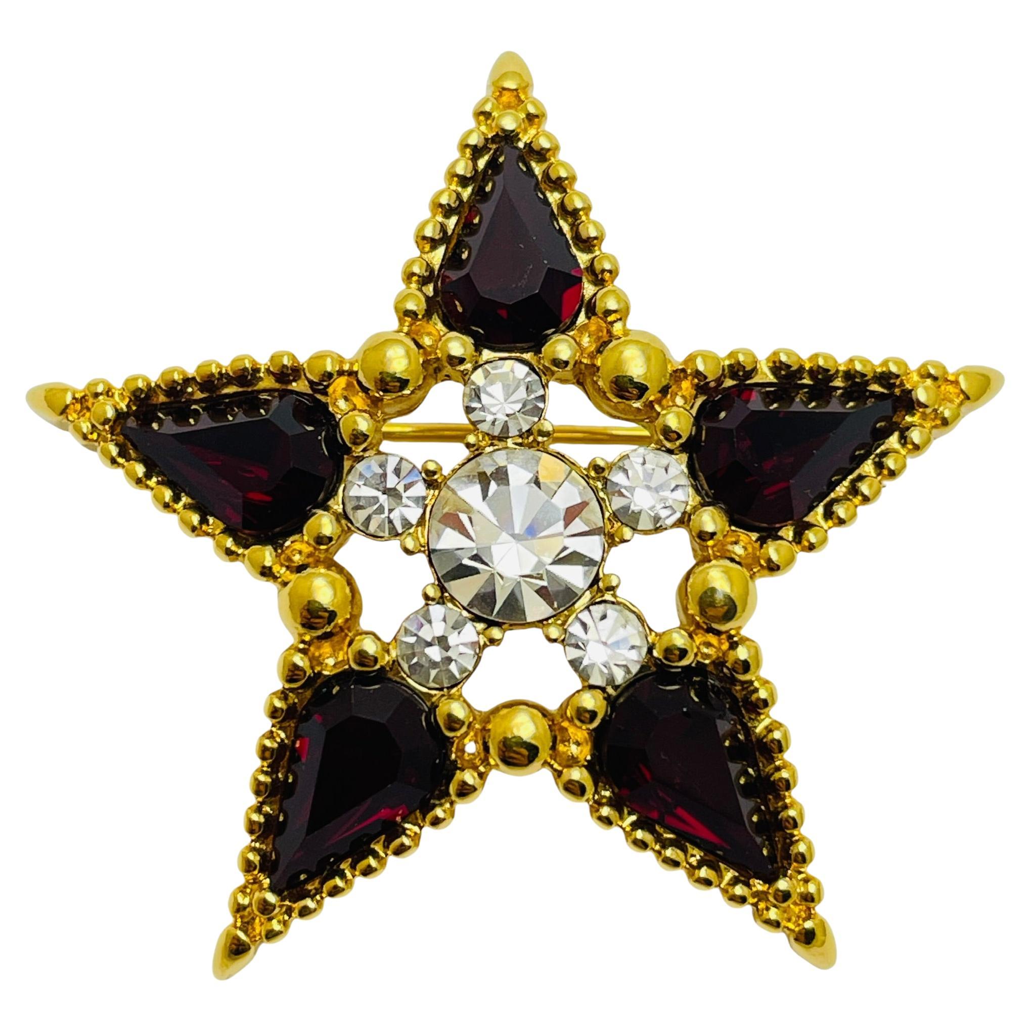 Vintage MONET signed gold tone red rhinestone designer star brooch