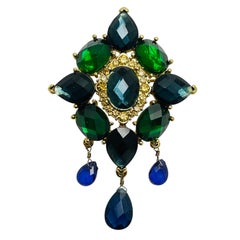 Broche vintage MONET firmado en tono dorado de cristal esmeralda zafiro de diseño