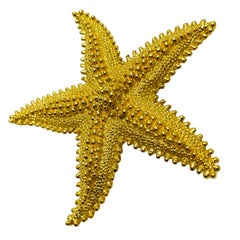 Vintage MONET signed gold tone starfish textured designer brooch