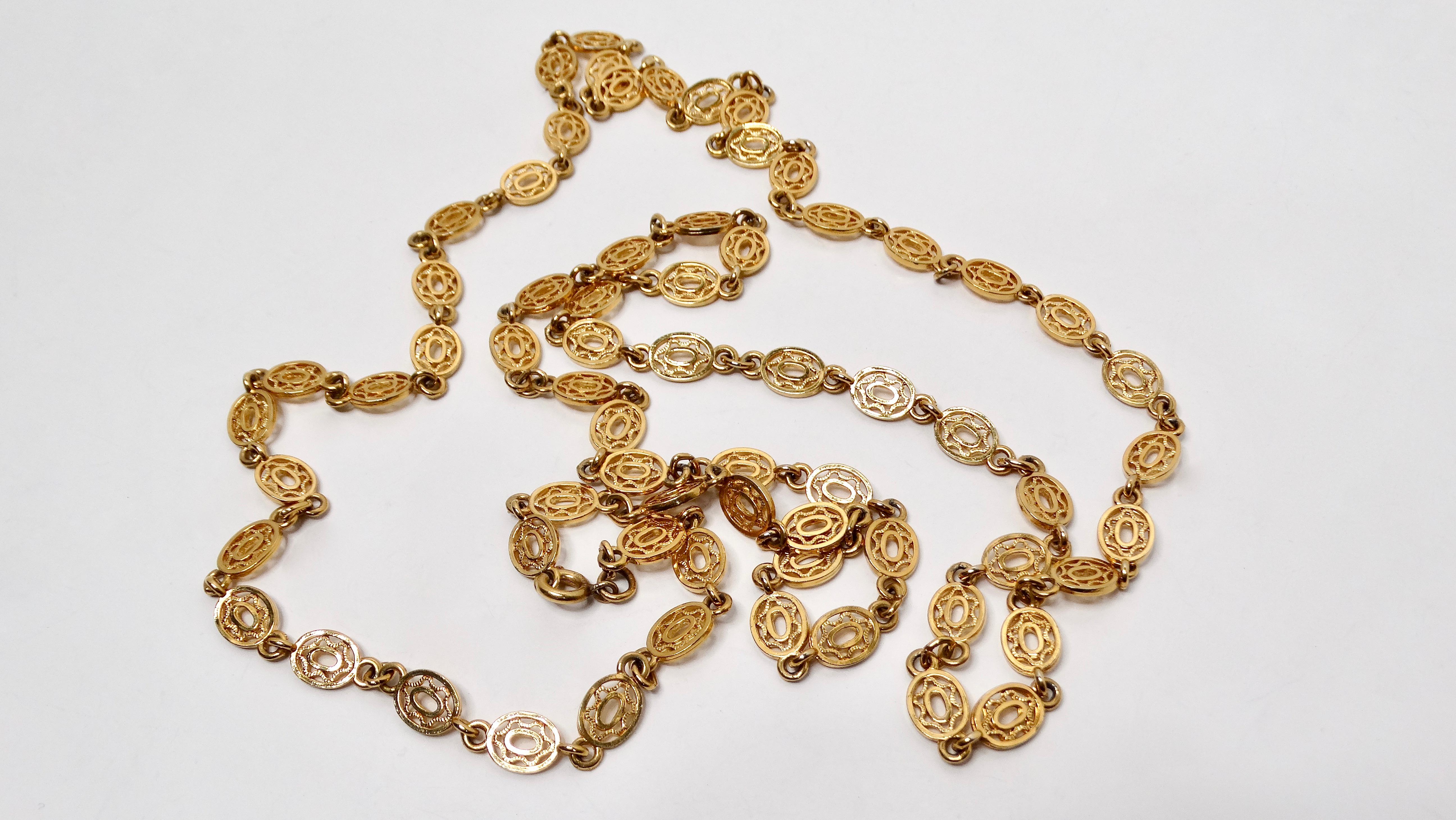 Introducing the Vintage Monet Victorian Link 18K Gold Plated Long Chain Necklace, a versatile and timeless piece that pays homage to the elegance of Victorian design. Crafted with luxurious 18K gold plating, this long chain necklace features