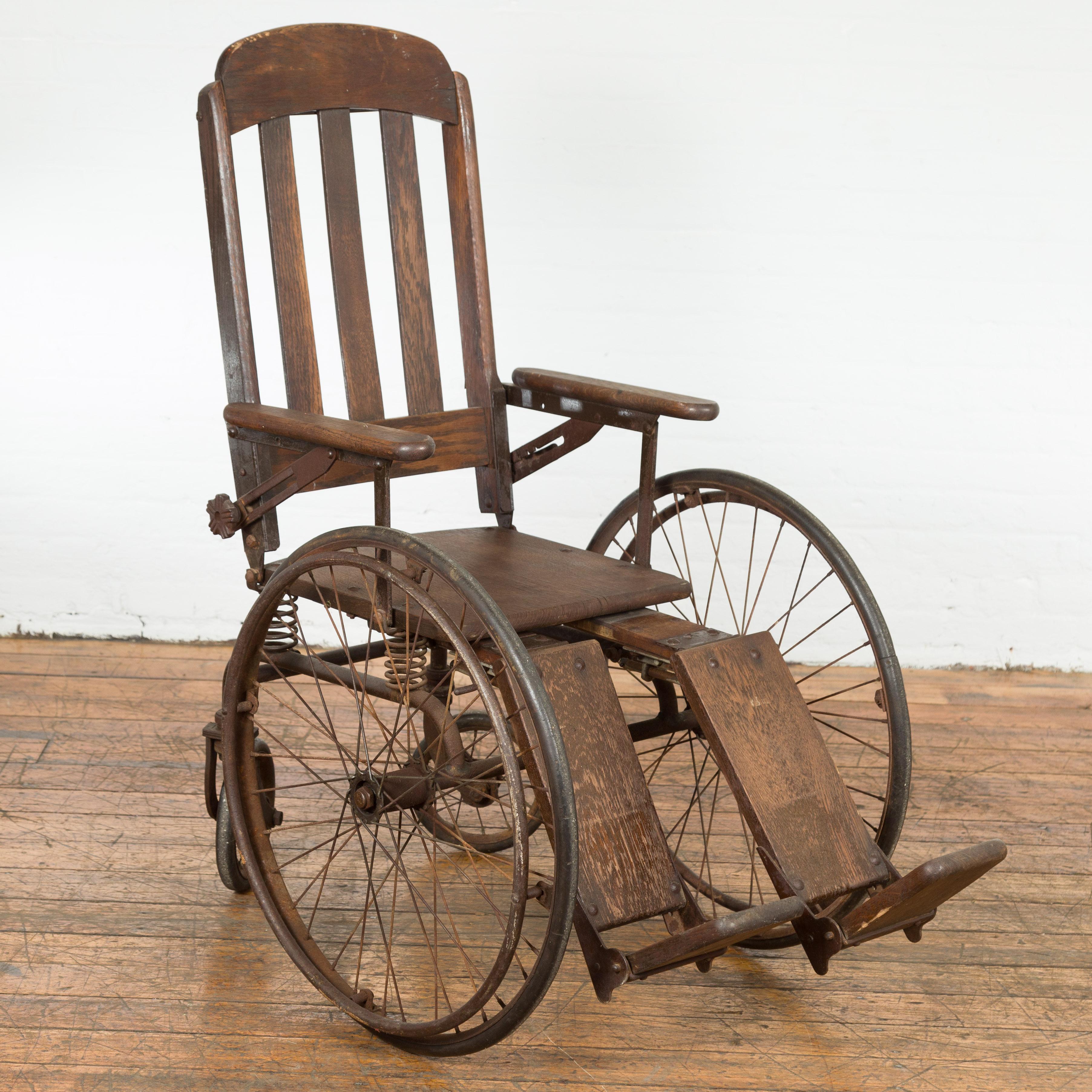 A vintage wooden wheelchair from Montgomery Wards in Grand Rapids, Michigan. Imbued with the spirit of an era bygone, this vintage wooden wheelchair from Montgomery Wards in Grand Rapids, Michigan, is a remarkable vestige of medical history and a