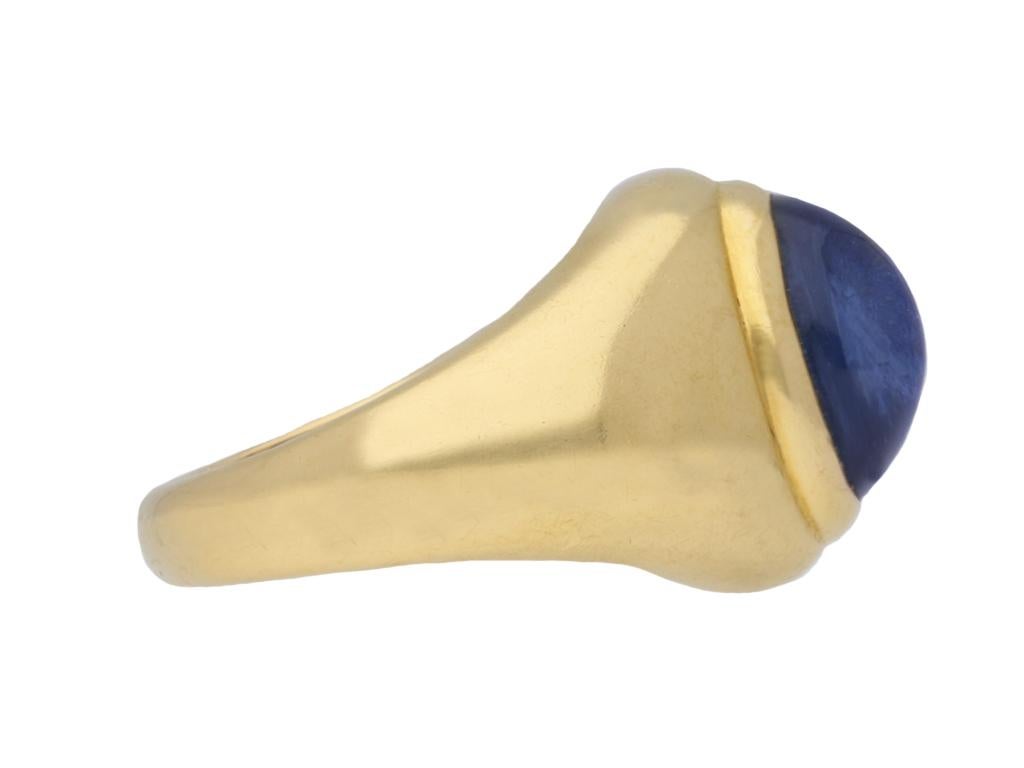 Vintage Monture Cartier Burmese sapphire ring. Set to centre with an oval cabochon natural unenhanced Burmese sapphire in an open back rubover setting with an approximate weight of 4.56 carats, to a bombé design with a smooth polished raised border