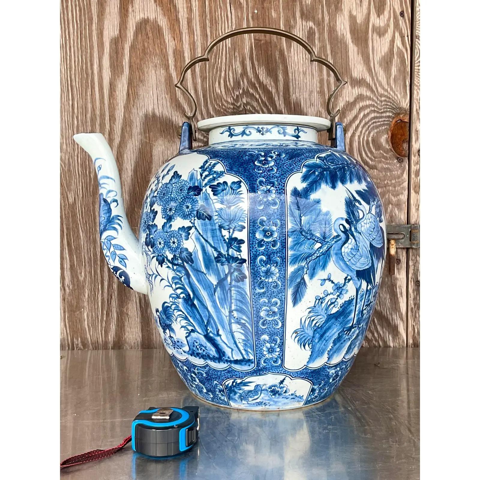 A fantastic monumental vintage Asian teapot. A beautiful blue and white design with the coveted crane. Large in size and drama. Acquired from a Palm Beach estate.