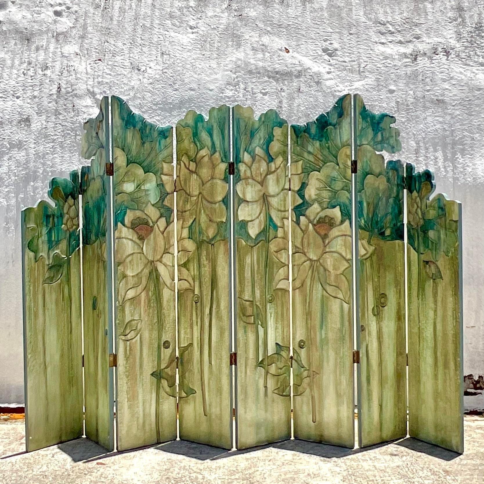 An absolutely beautiful folding screen. Monumental in Size and drama. Beautifully hand carved floral design with an incredible ombré color design. Totally breathtaking. Acquired from a Palm Beach estate.