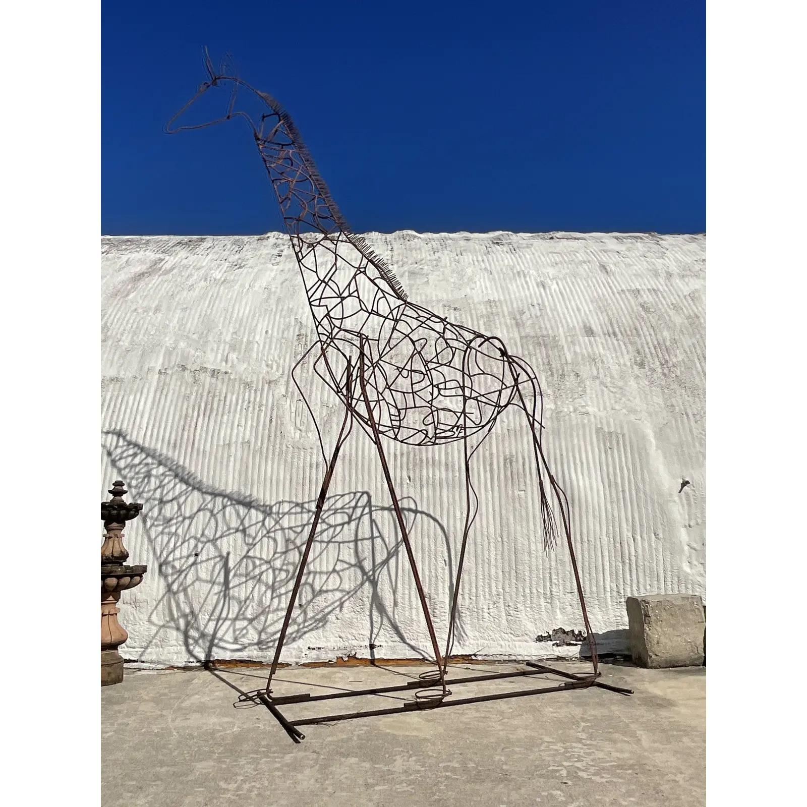 An incredible vintage steel rebar sculpture. Beautiful patinated finish on this huge giraffe composition. Monumental in size and drama. Signed. Acquired from a Palm Beach estate.