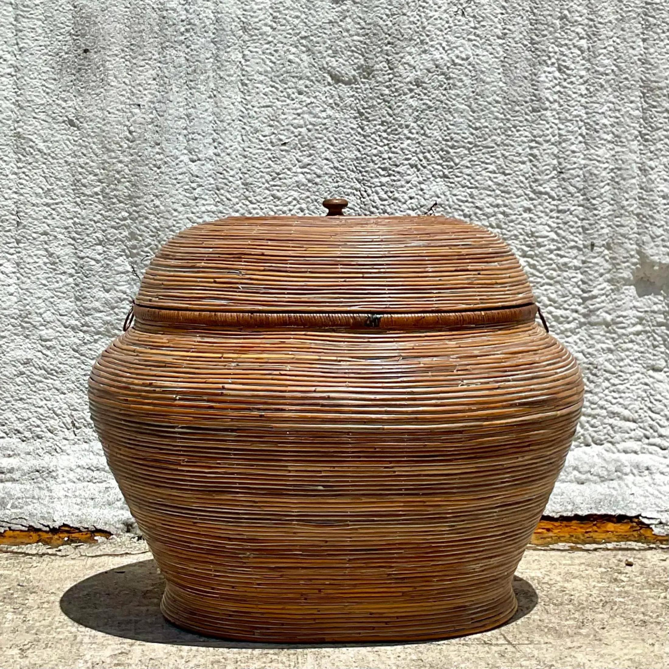 A gorgeous vintage monumental lidded basket. Done in a chic cerused pencil reed. Large in size and drama. Acquired from a Palm Beach estate