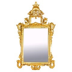 Monumental miroir décoratif italien rococo en bois doré du 20ème siècle