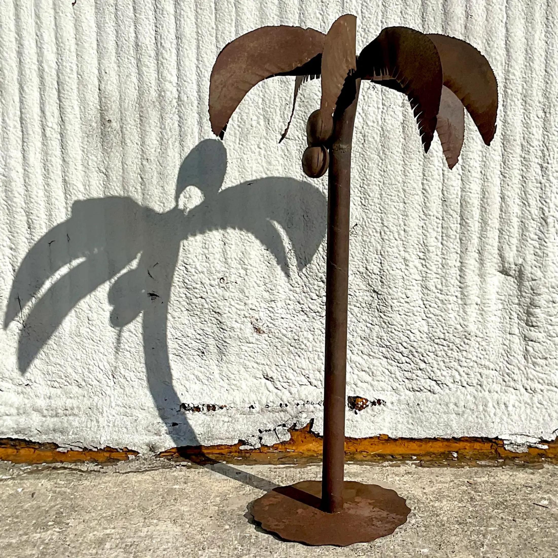 A fantastic vintage patinated metal palm tree. A chic torch cut design in a gnarly metal finish. A real boho tropical look. Acquired from a Palm Beach estate.