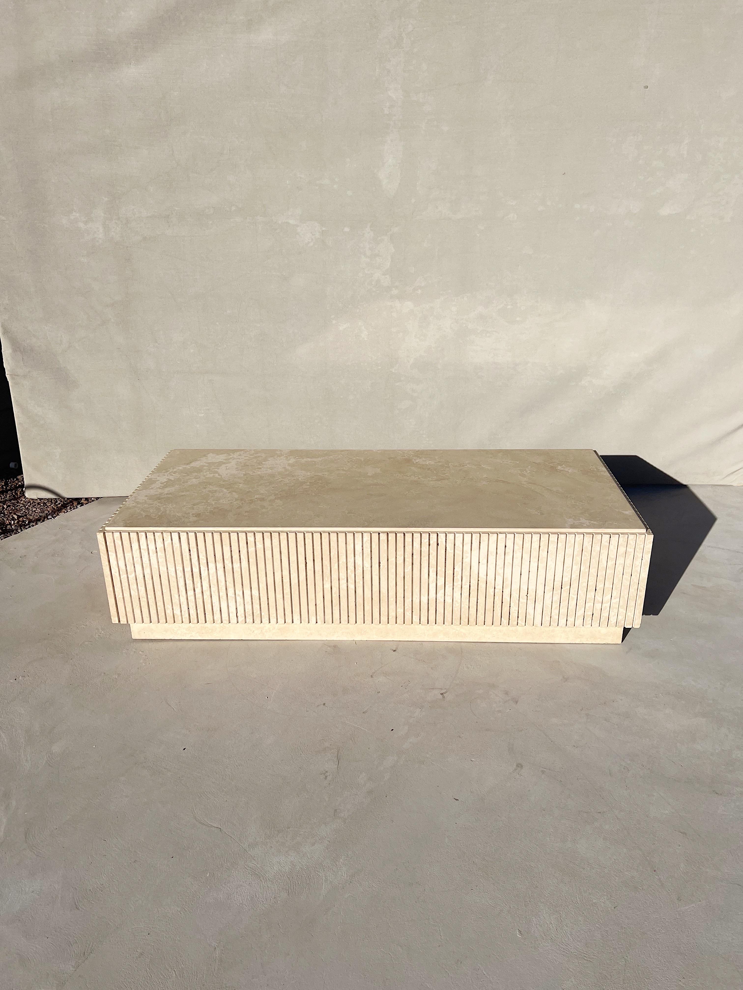 Vintage Monumental Plinth Italian travertine coffee table

An extraordinary, one of a kind, custom made, vintage Italian fluted travertine plinth coffee table

A coffee table monumental in size and elegance.

The travertine, a work of