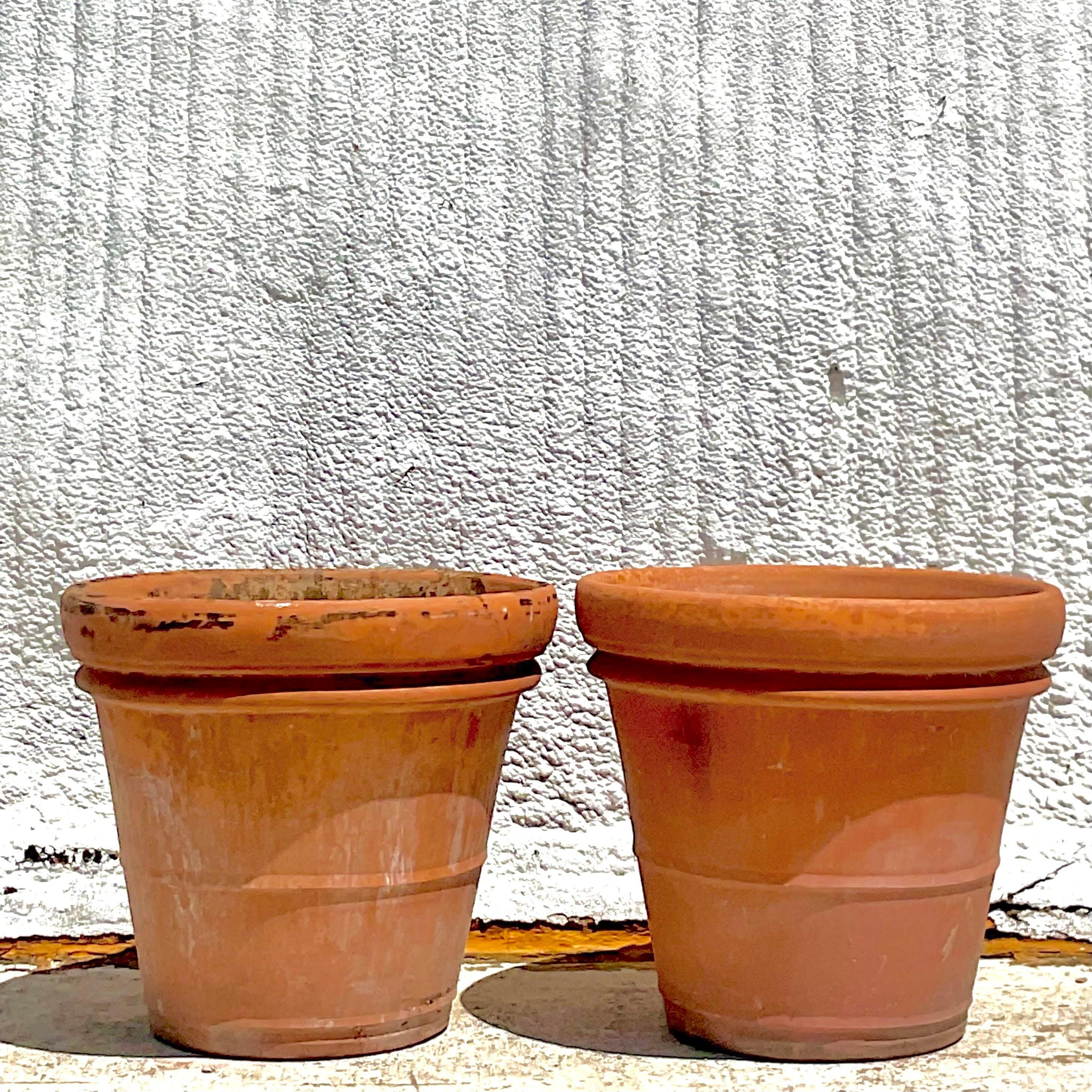 A fantastic pair of vintage monumental terracotta planters that would be a great addition to your garden. Acquired at a Palm Beach estate. 