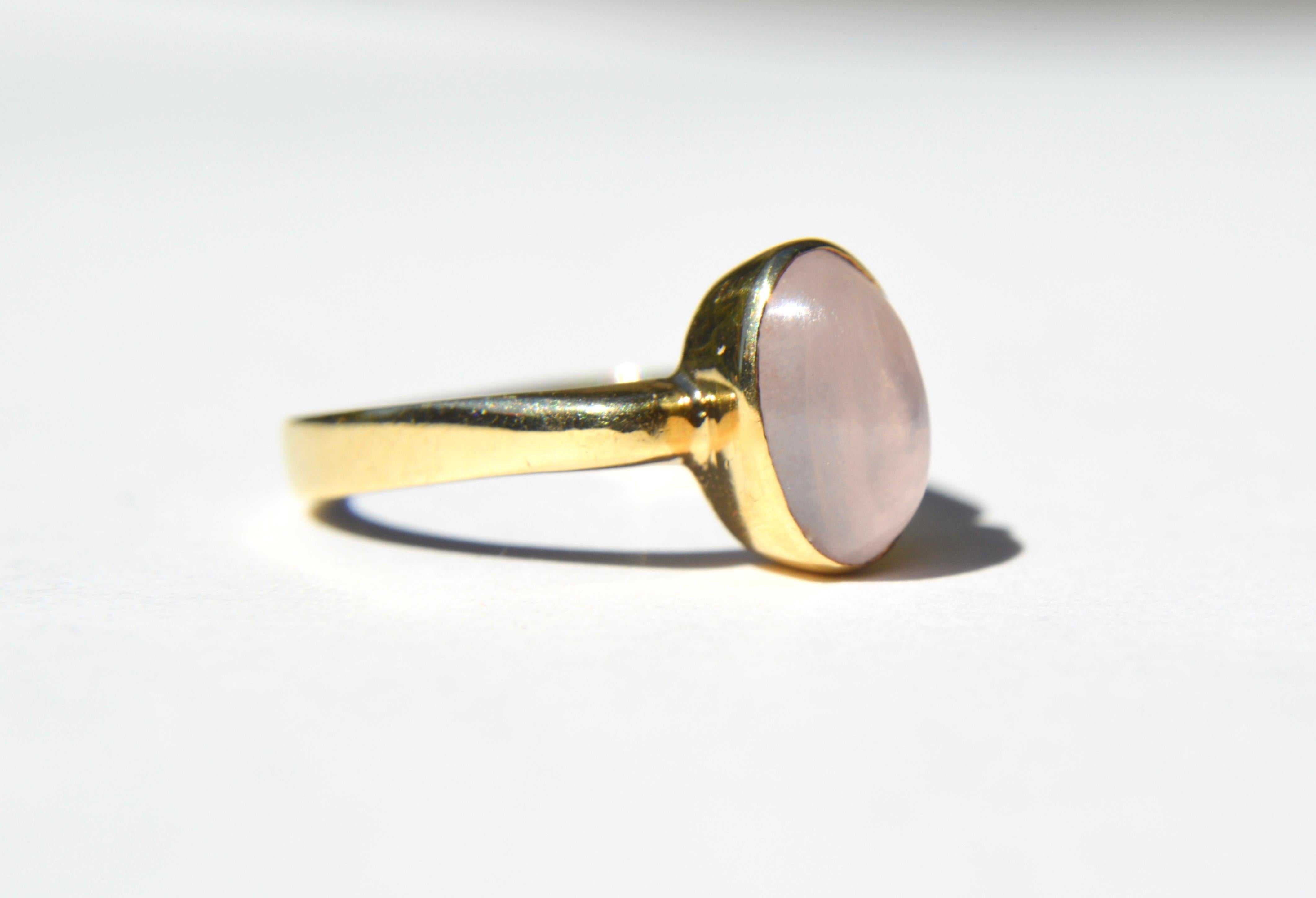 Gorgeous vintage 1960s moonstone cabochon bezel set ring in solid 8K gold. Size 6.25, resizable by a jeweler. In very good condition. Moonstone measures 10 x 7mm. Marked and tested as 535 (8K).