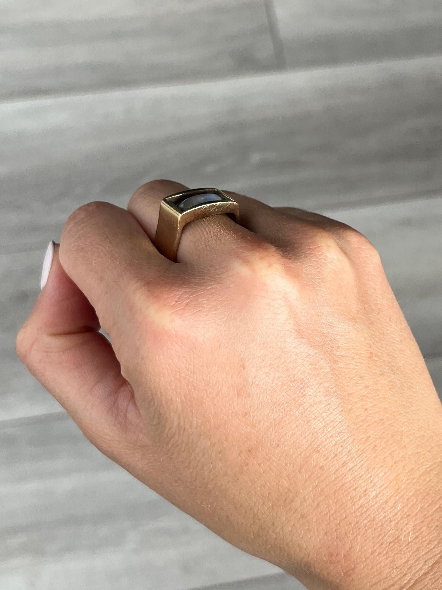 The stunning moonstone in this ring has the most beautiful blue glow. The stone is set very simply as not to detract from the main feature. The 9ct gold ring is smooth, simple and chunky. Hallmarked London 1974.

Ring Size: O 1/2 or 7 1/2
Stone