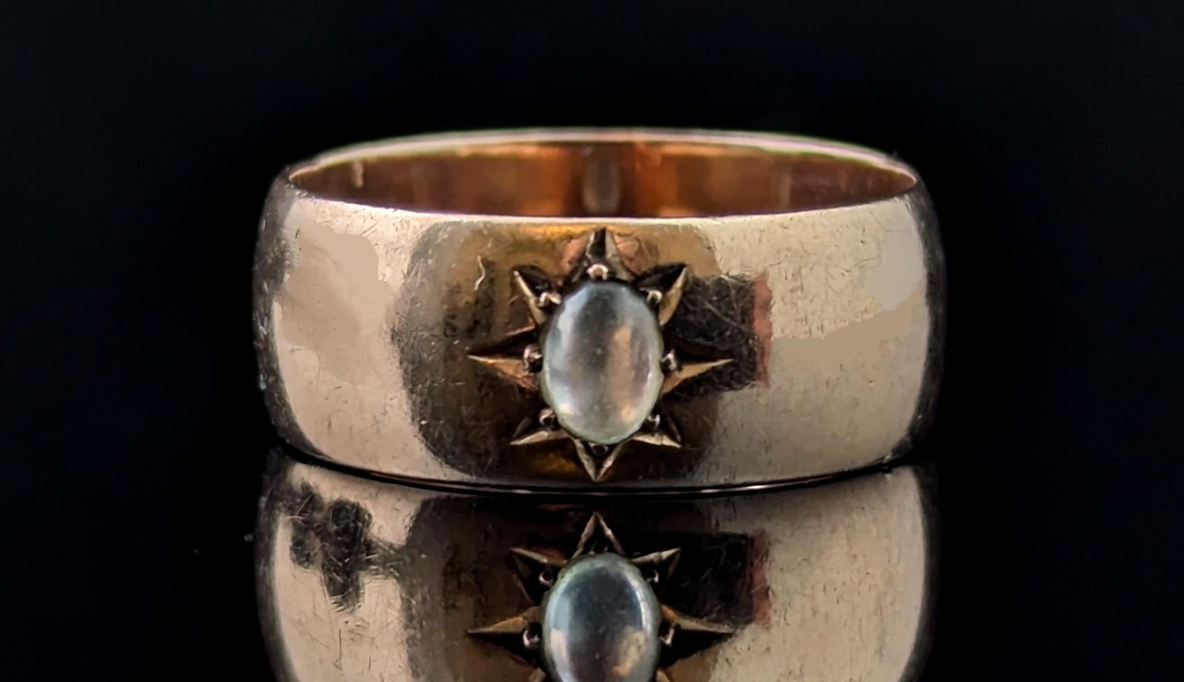 A gorgeous vintage 9ct Rose gold Moonstone star set band ring.

Lovely warm rosey gold contrasts beautifully with the cool moonstone cabochon star set to the face of the ring.

This is a lovely chunky cigar style band ring with a nice wide, slight D