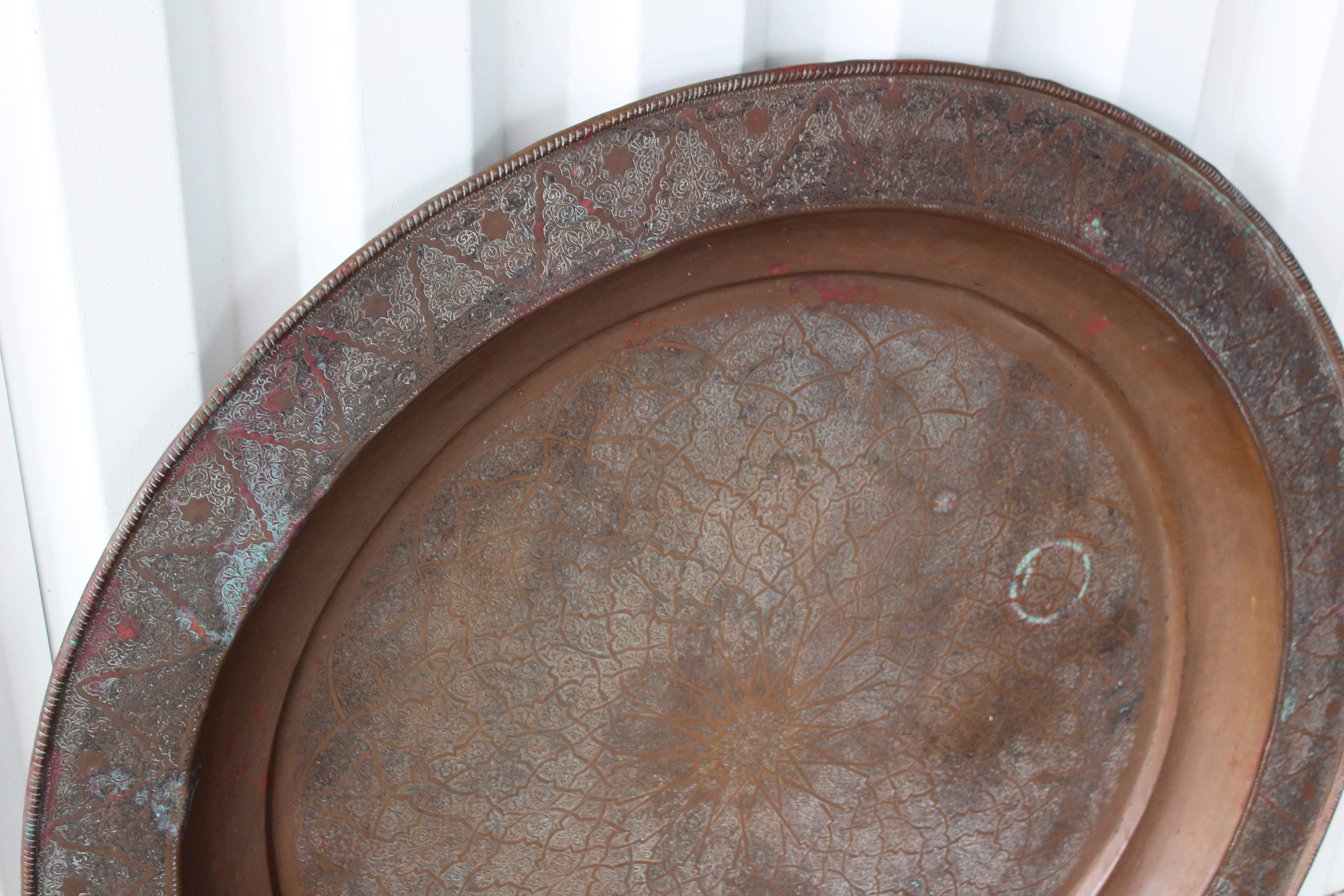 Vintage Moorish 19th century etched copper tray. Original condition with age appropriate wear. Shows verdigris patina.