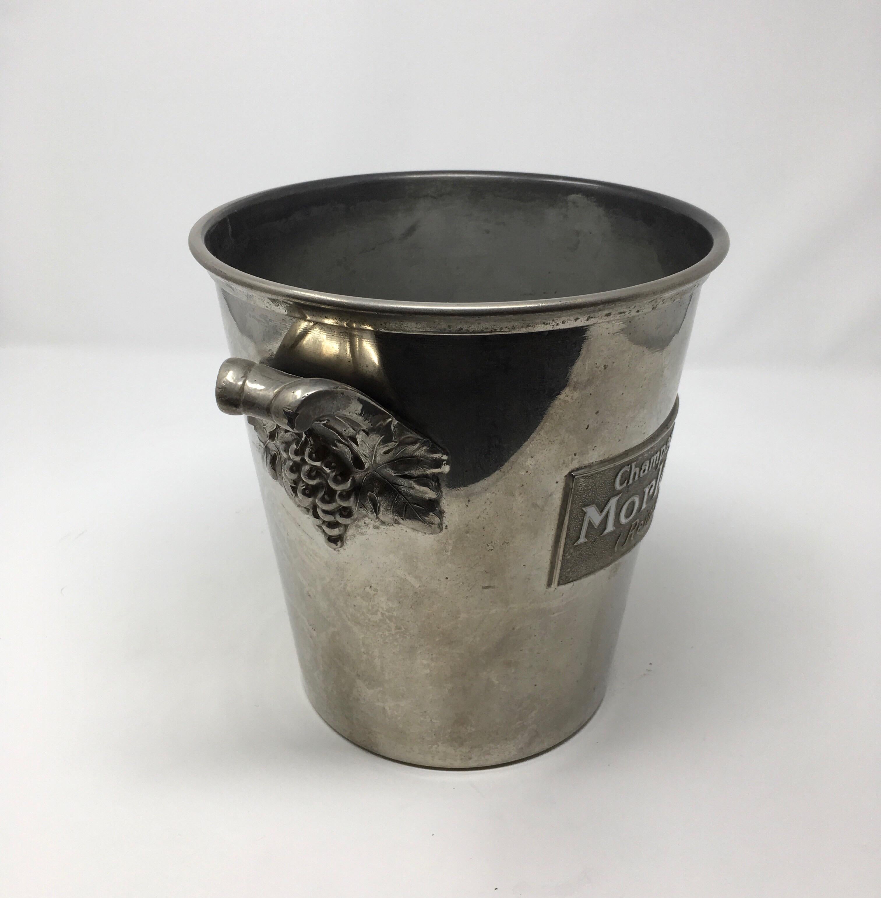 Found in France, this vintage Morlant ice/Champagne bucket is in excellent original condition. Made in solid pewter with a plaque emblazoned with the champagne makers name and logo, Morlant (Reims) on the front it has two decorative handles in the