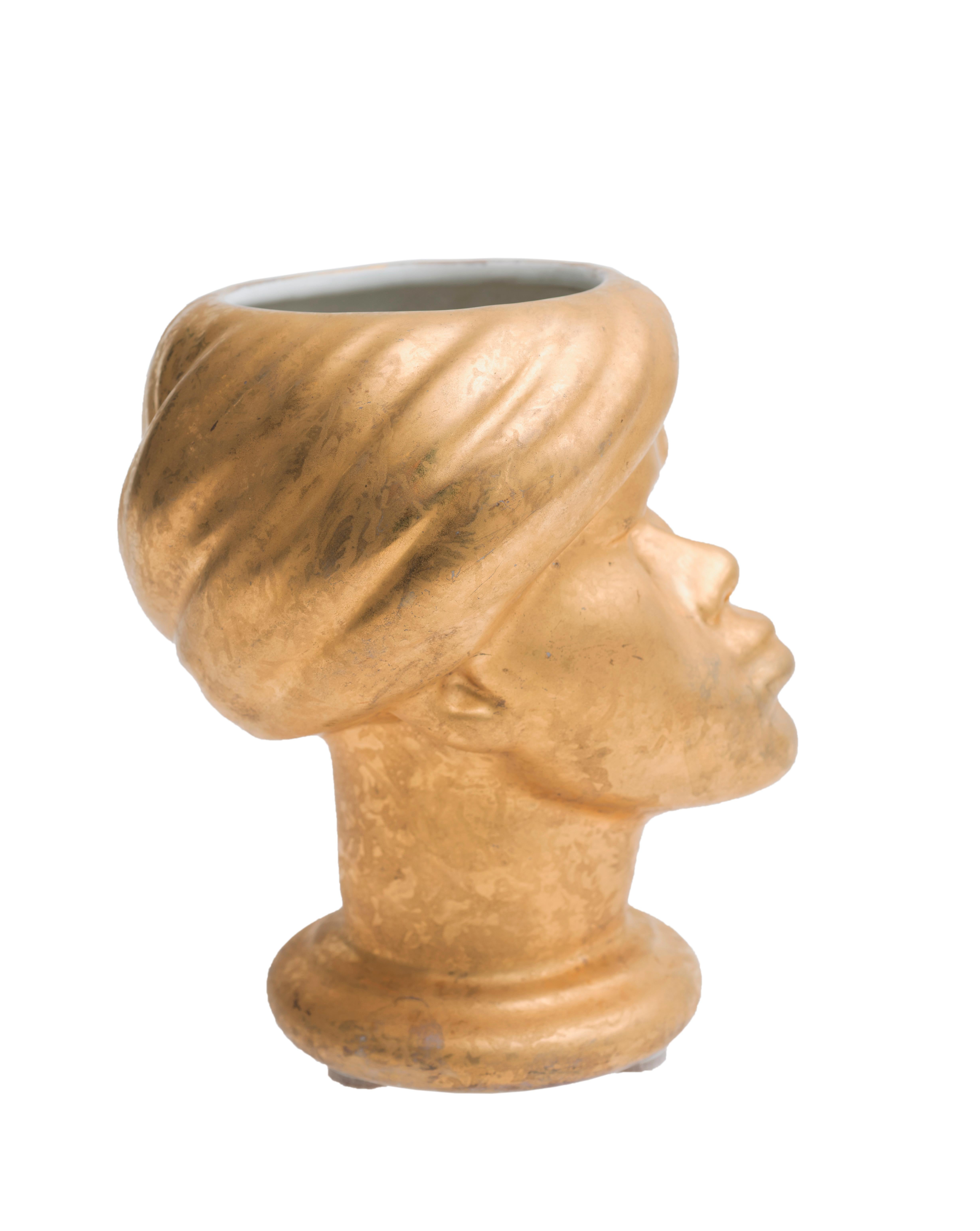 Magnificent enameled gold ceramic vase by Piero Fornasetti (Milan 1913-1988), considered among the most original and creative talents of the 21st century.
A rare piece depicting the head of a Moor.
Near perfect conditions.

 
