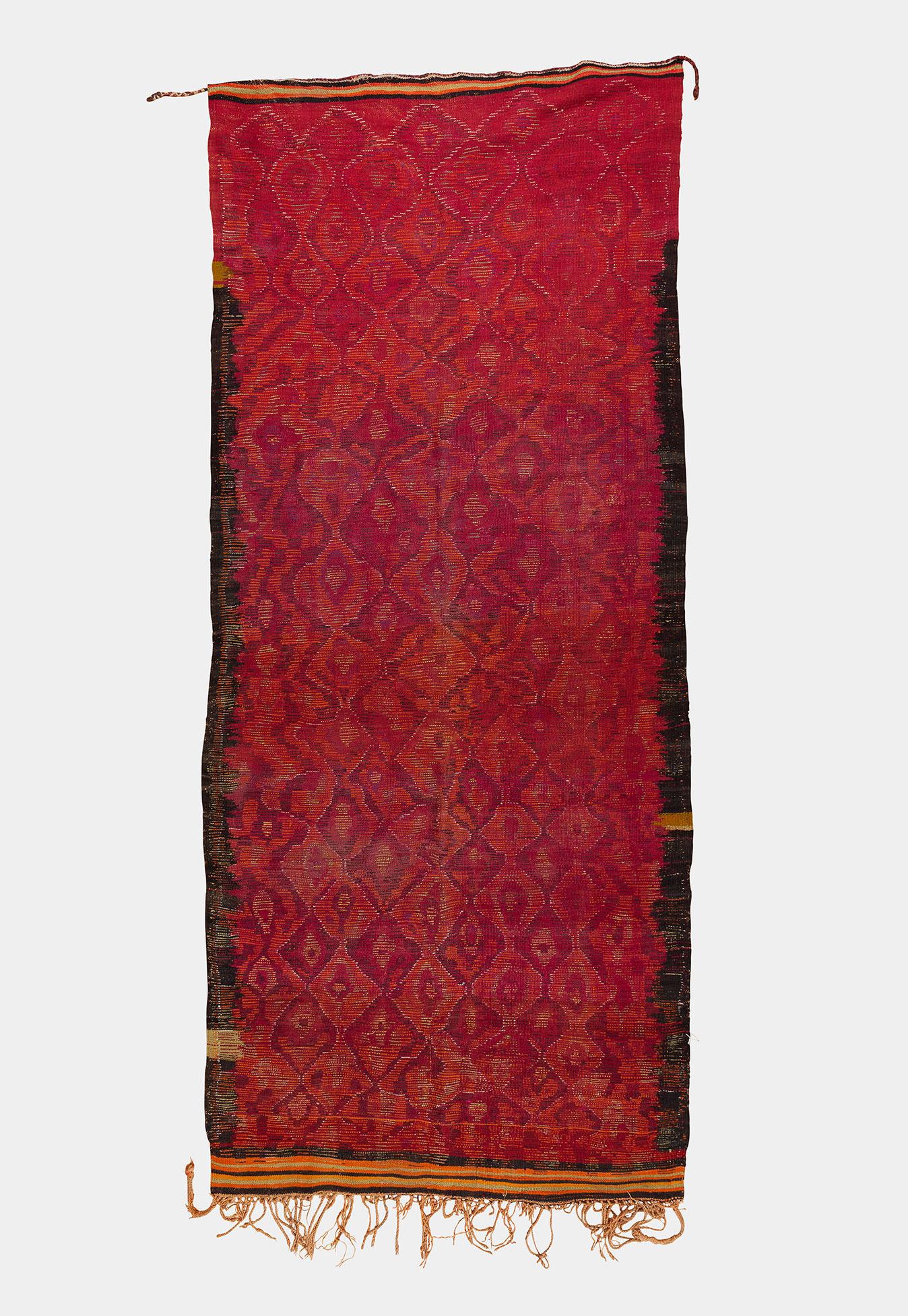 Colorful Moroccan Berber rug from the Ait Bou Ichauen region. Multicolor pattern is typical to the Ait Bou Ichauen tribe that originates from eastern Morocco around the city of Anoual. Medium-thick pile.

This is an authentic Berber carpet from