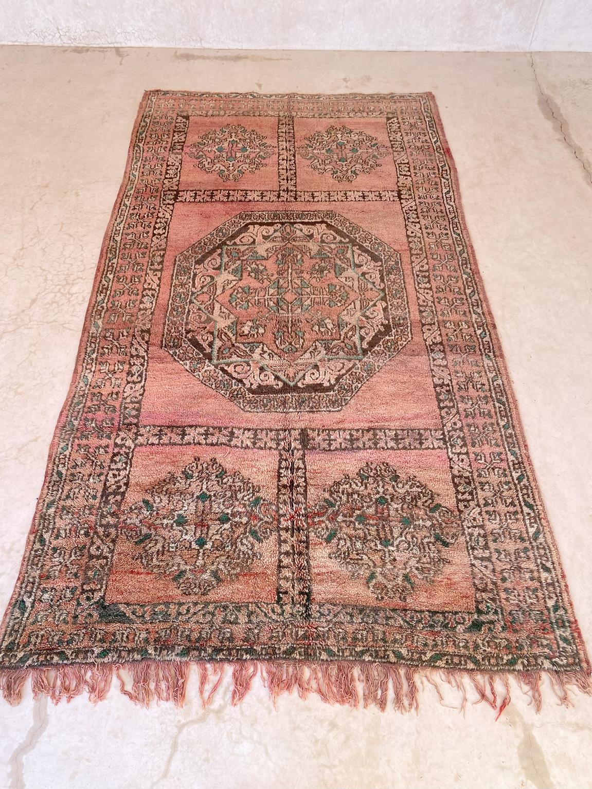 I selected this large, vintage Ait Yacoub rug from piles of carpets because I think that it's a lovely piece with such sweet colors and a great bohemian vibe! The composition of the rug is typical from that tribe, with a central floral design
