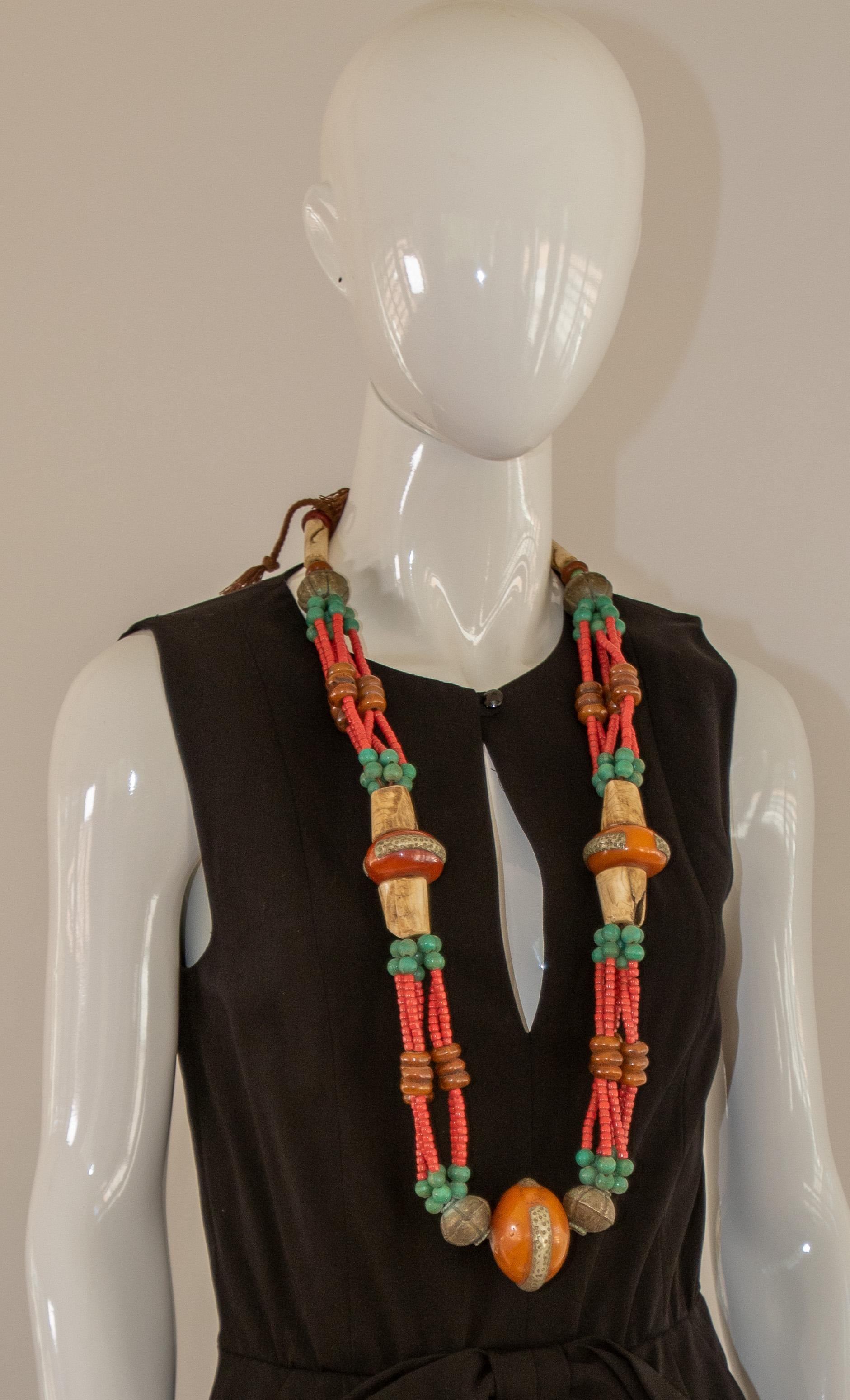 Stunning vintage Moroccan hand crafted, vibrantly colored Berber tribal faux amber resin wedding necklace.  
Striking Amazigh (Berber) wedding necklace comprising faux coral, amazonite, with old animal-horn and faux amber from the Atlas Mountains,