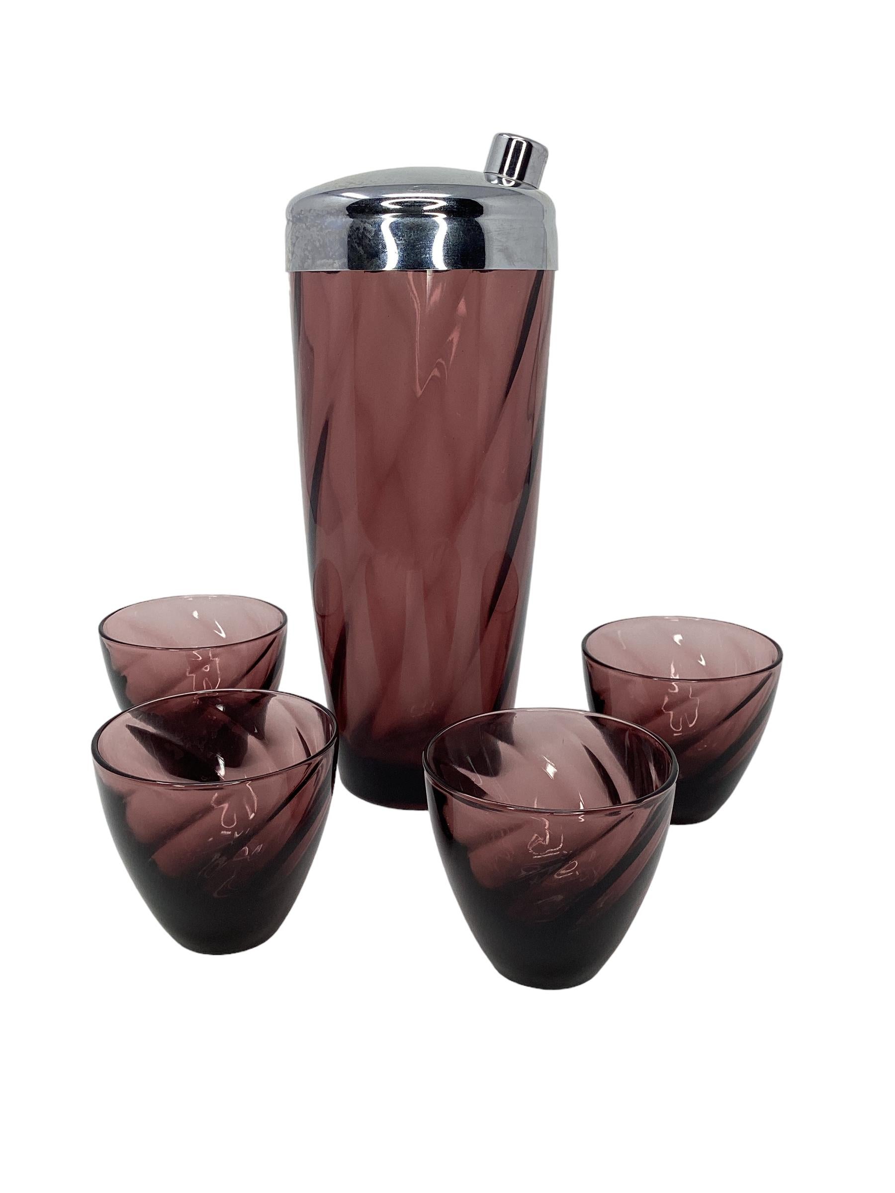 Vintage Moroccan Amethyst Swirl Cocktail Set by Hazel-Atlas. Consisting of a large cocktail shaker with a chrome lid and 4 small cocktail glasses.
Shaker 3.75