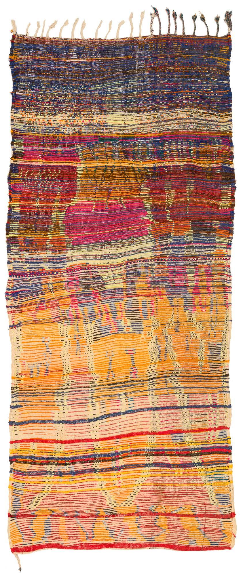 We love this funkily colored and designed rug. Not a very old rug but made for home use. This rug has the feeling of an authentically made tribal rug that has not been woven for the commercial market. An amazingly crazy spirit was the author of this